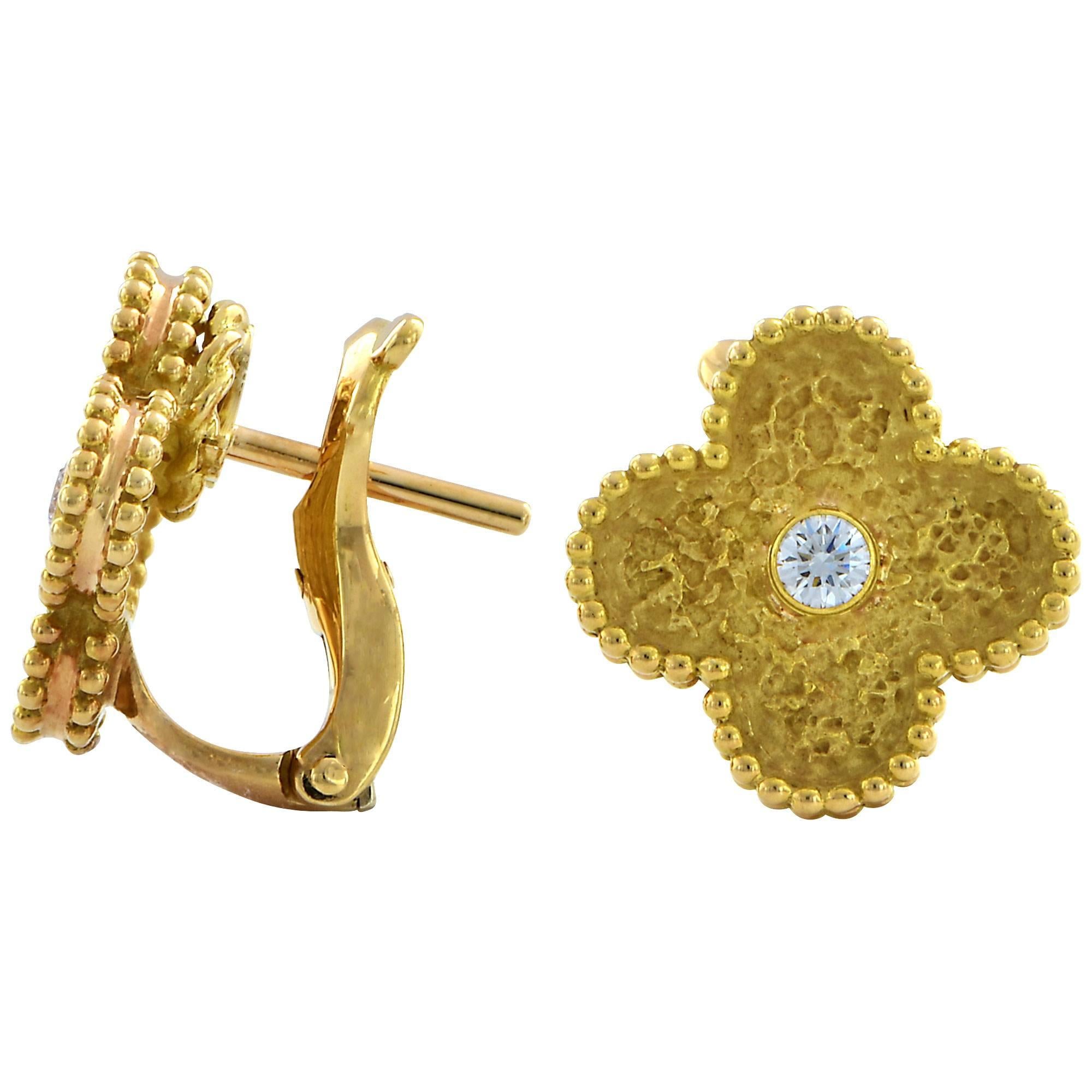 Van Cleef & Arpels Vintage Alhambra diamond earrings, can be worn with a post or as clip-on.

The earrings measure 13.6mm.
It is stamped and/or tested as 18k gold.
The metal weight is 7.61 grams.

These diamond and gold earrings are accompanied