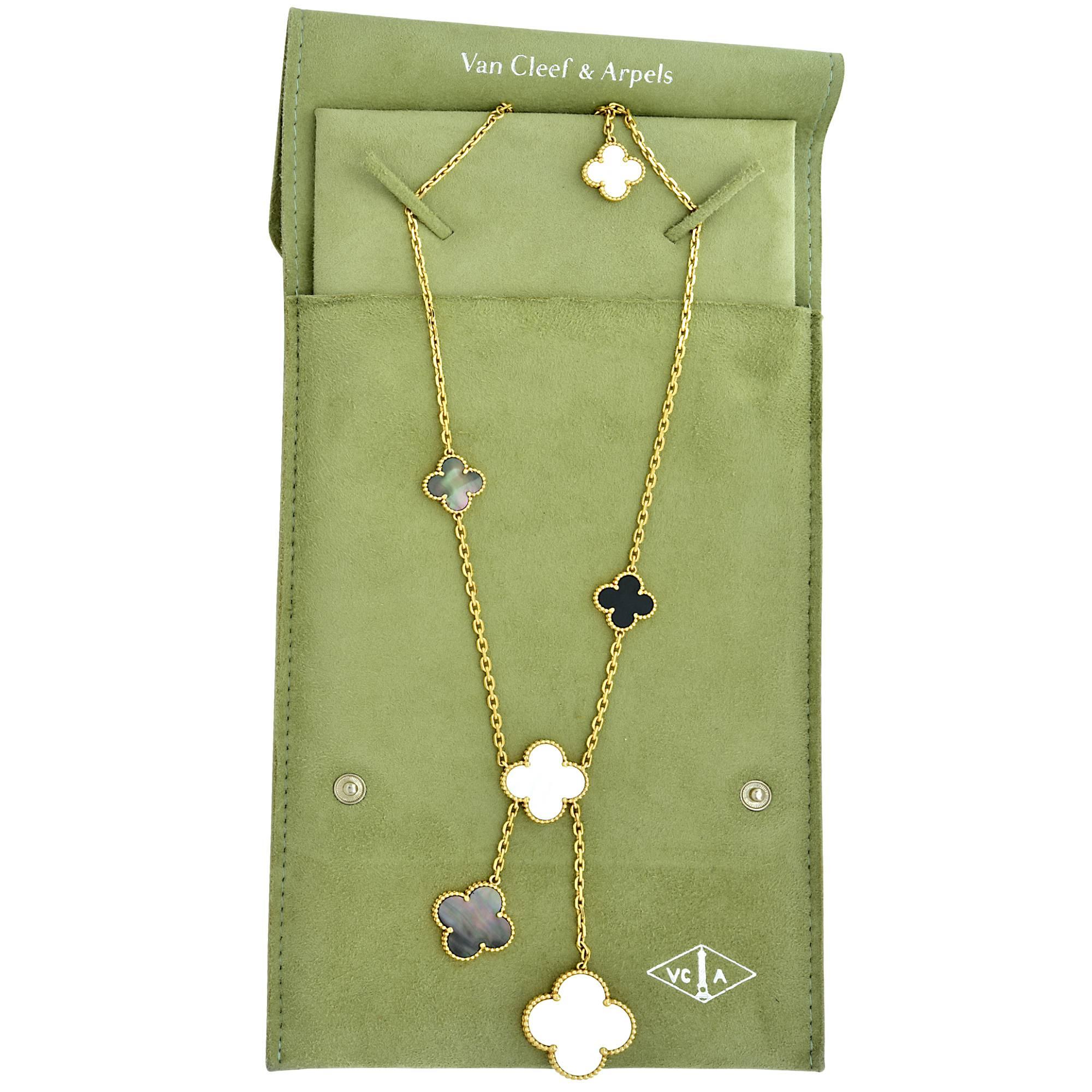 Van Cleef & Arpels 18k yellow gold Alhambra Magic necklace featuring 6 motifs containing mother of pearl, black mother of pearl and onyx.

It is stamped and/or tested as 18k gold.
The metal weight is 25.65 grams.

This VCA necklace is accompanied by