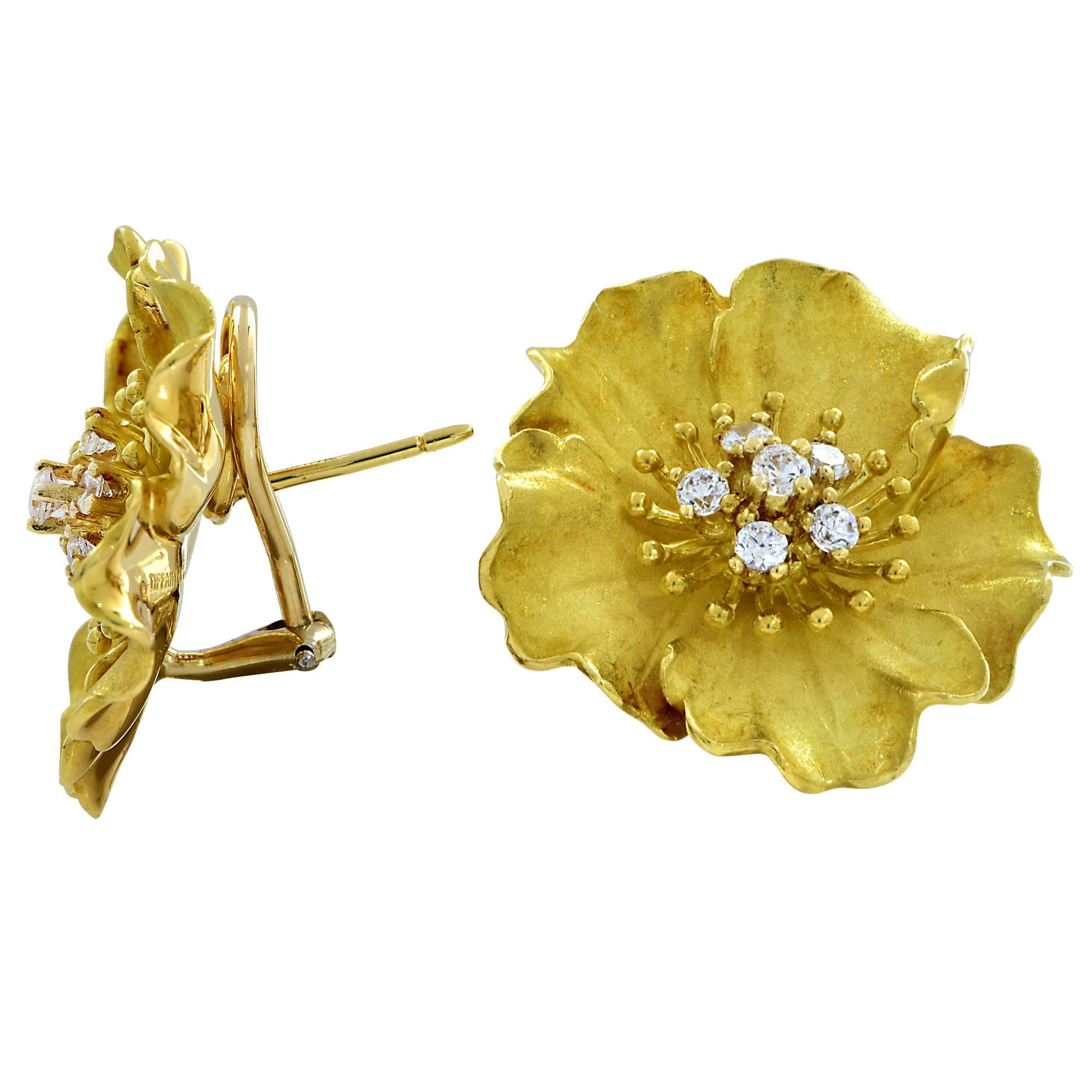 Fabulous 18k yellow gold Tiffany & Co. Alpine Rose earrings circa 1980. Crafted to have 5 flower petals that feature 5 gleaming round brilliant cut diamonds, F-G color, VS1-2 clarity that weigh .75cts total.

These magnificent earrings measure 27mm