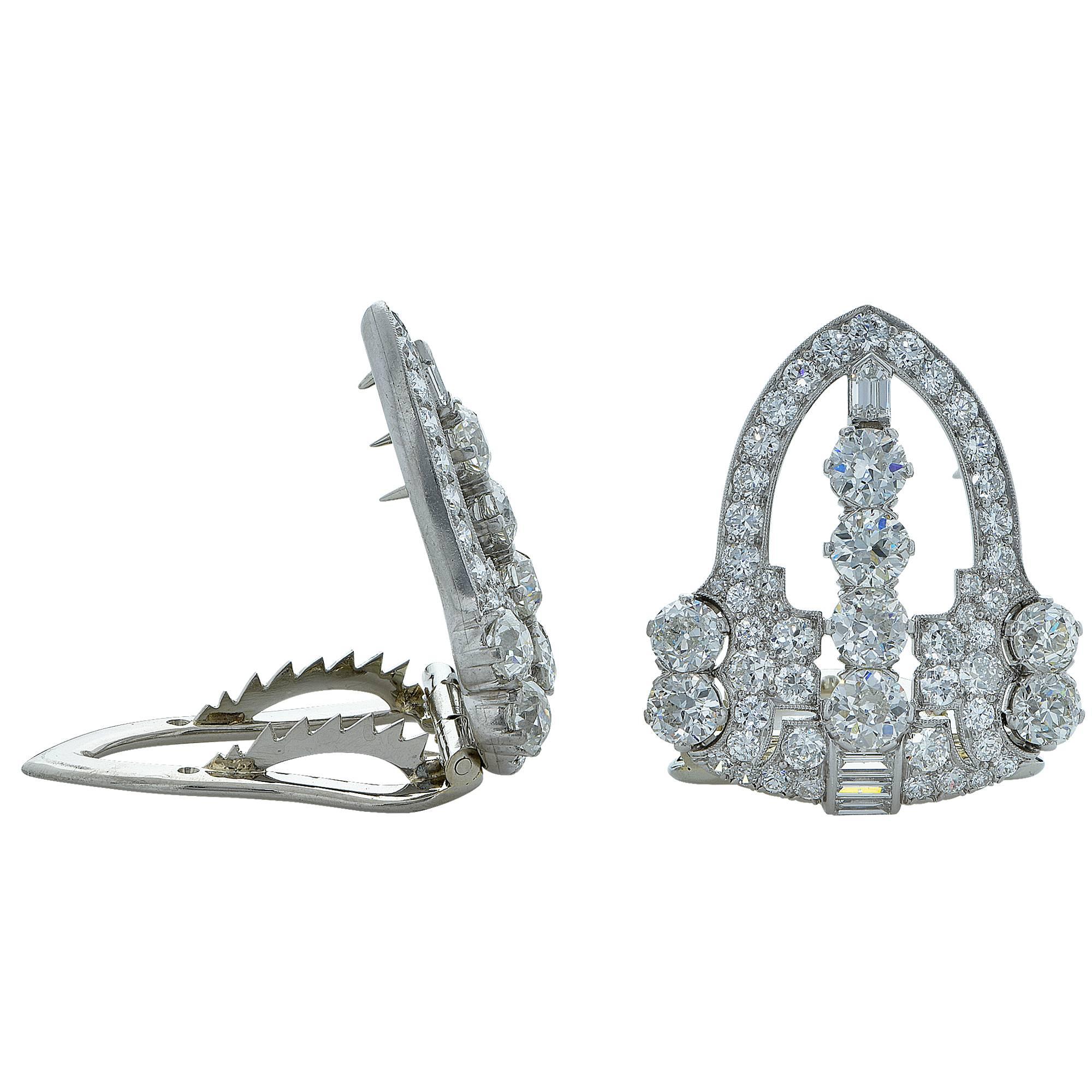 Platinum Art Deco Raymond Yard dress clips featuring approximately 8cts of European, baguette and shield cut diamonds. These gorgeous clips will compliment even the most discerning of jewelry aficionados.

These clips measure 1.09 inches in height