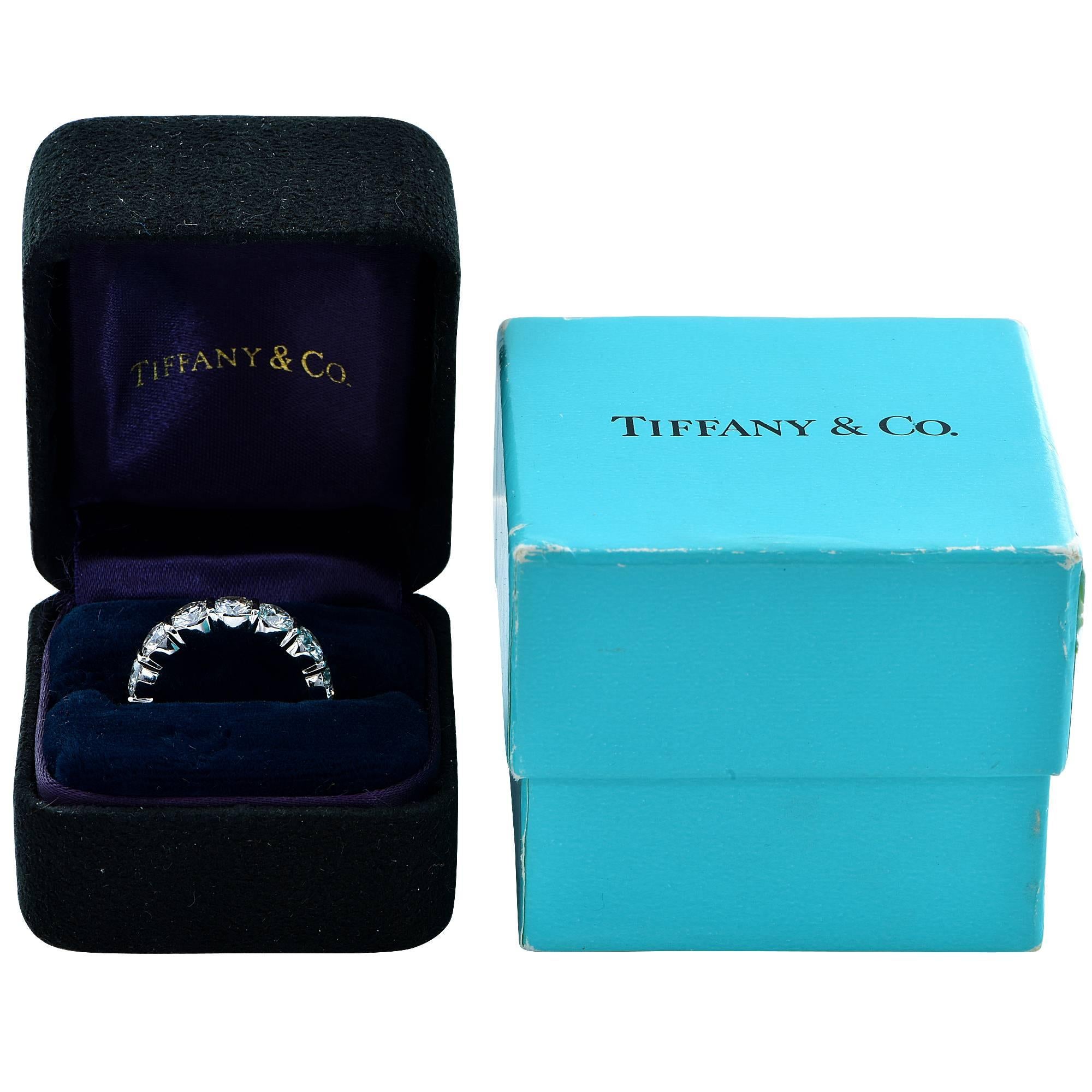 This beautiful Tiffany & Co. eternity band is in like new condition. It features 14 hand picked matching round brilliant cut diamonds weighing 4.40cts G-H color and VVS-VS clarity.

The ring is a size 5 and cannot be sized up or down.
It is