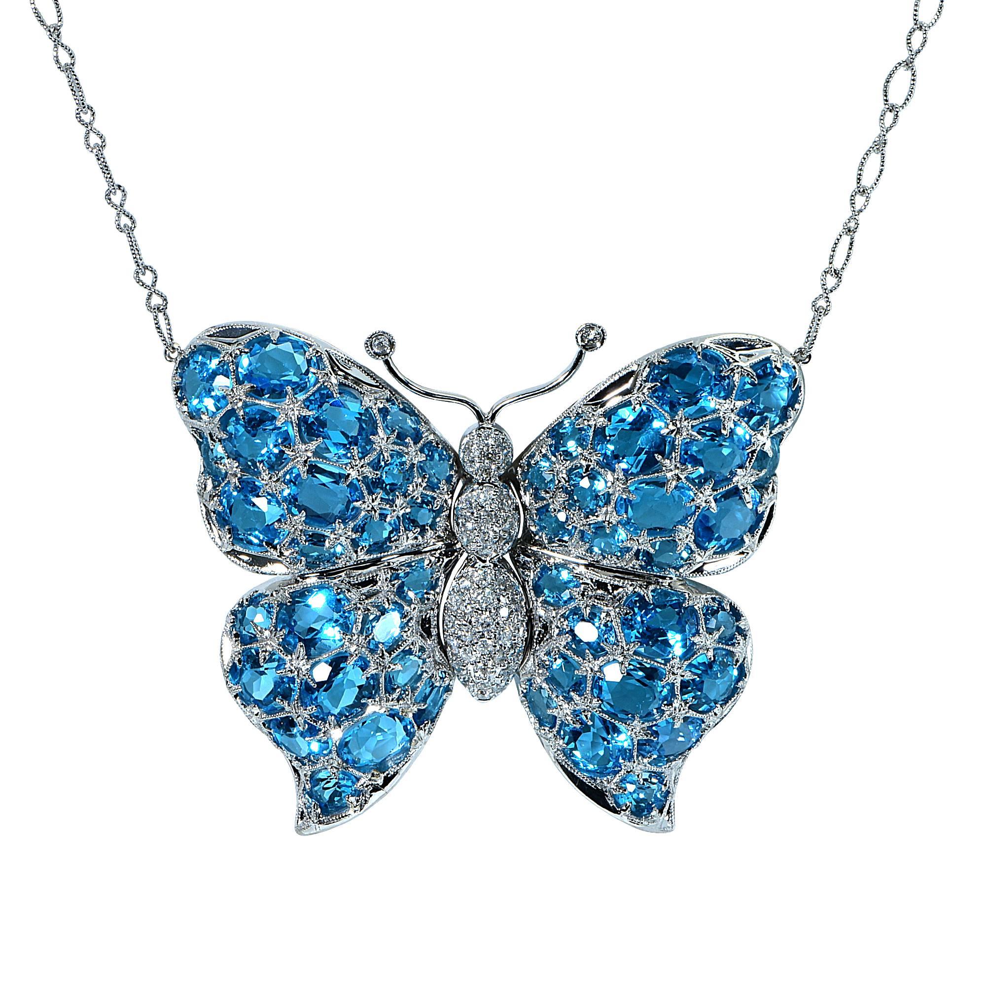 18k white gold butterfly necklace featuring 47 electric blue topaz weighing approximately 75cts total accented by 43 round brilliant cut diamonds weighing .65cst total, G color SI clarity.

It is stamped and/or tested as 18k gold.
The metal weight