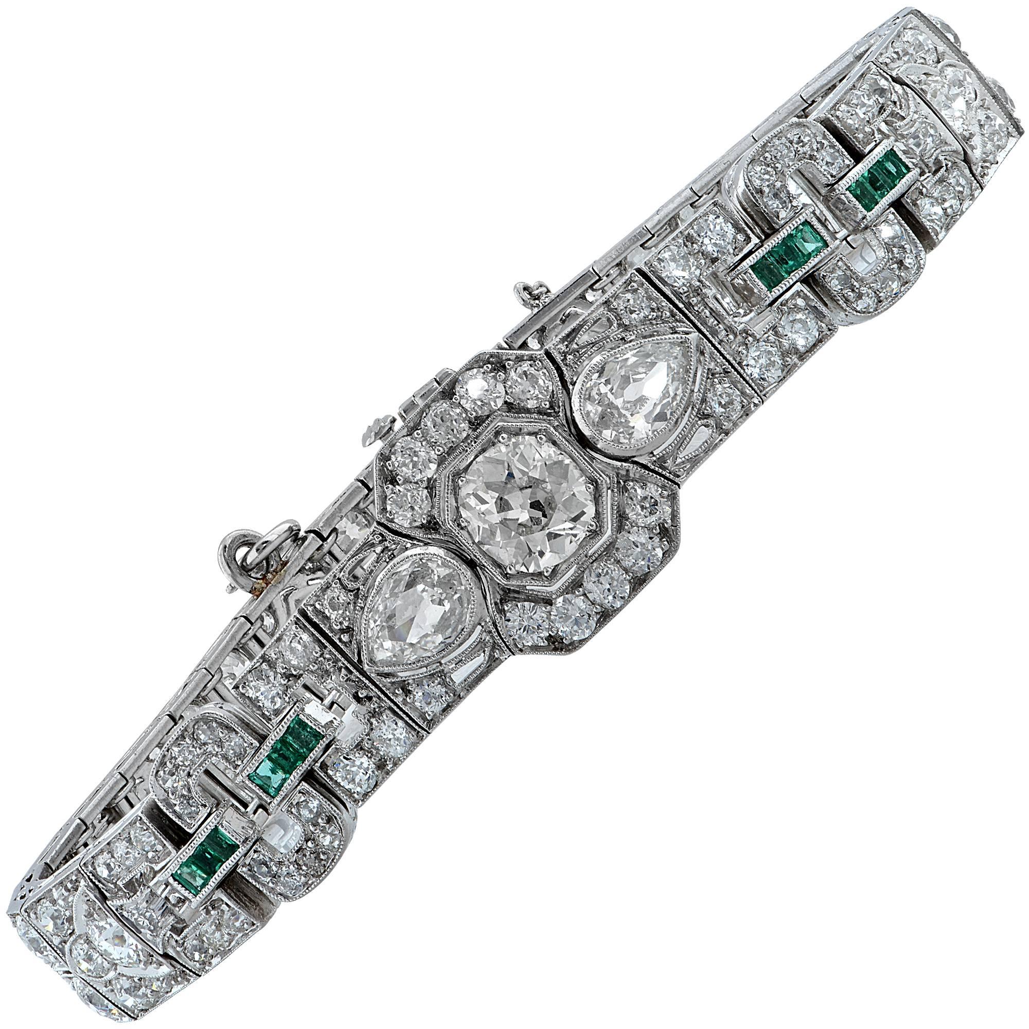 Platinum Art Deco bracelet containing a European cut diamond weighing approximately 1ct in the center of the bracelet, flanked by 2 pear shape diamonds weighing approximately 1ct total. The bracelet is further adorned with 57 European cut diamonds
