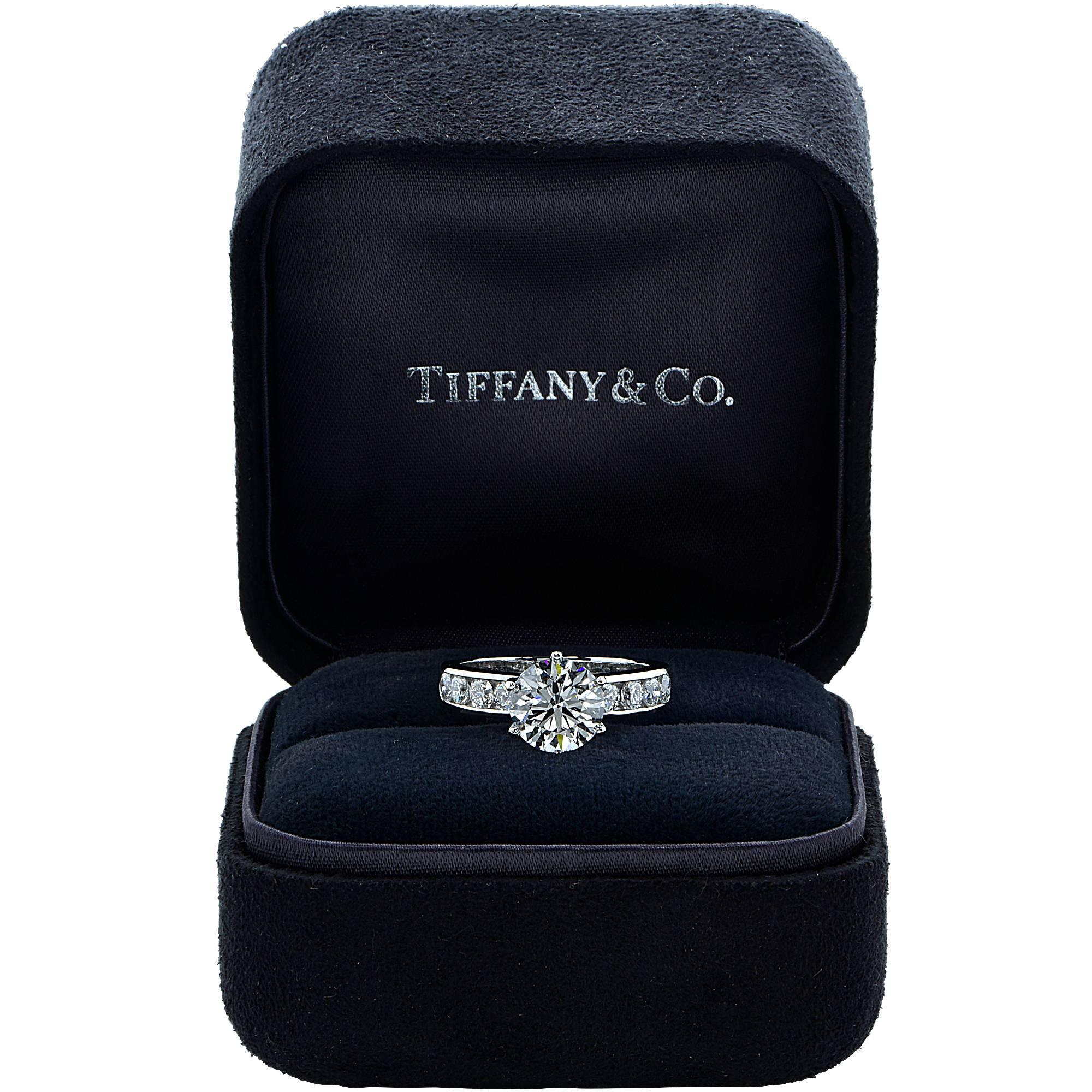 This beautiful platinum Tiffany & Co. ring features a 2.41ct round brilliant cut diamond H color VVS clarity with excellent polish, symmetry and polish. The center stone is laser inscribed with the Tiffany & Co diamond registration number.