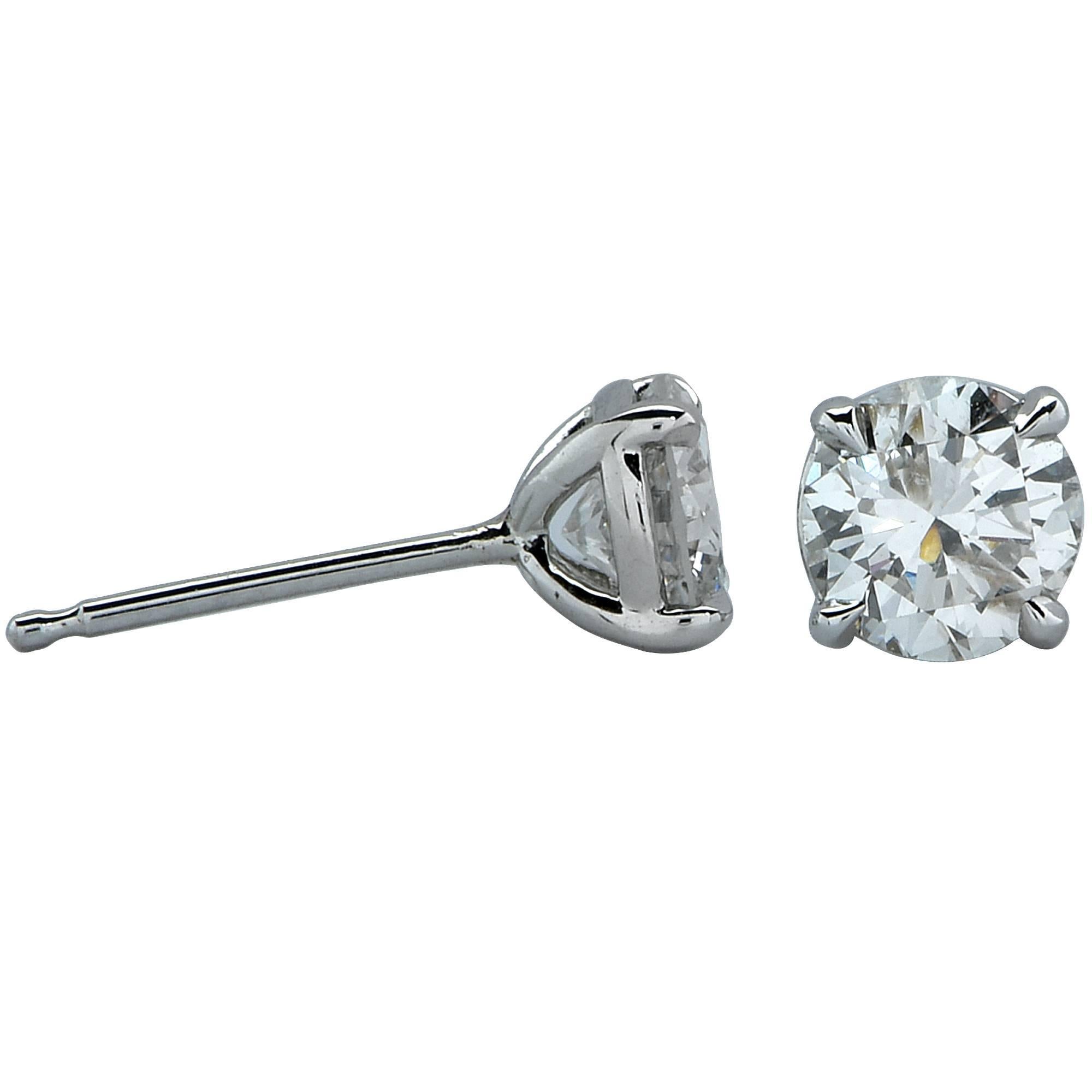 18k white gold 1.23 carat total weight diamond solitaire stud earrings featuring a matching .62ct round brilliant cut diamond H-I color and SI in clarity and .61ct round brilliant cut diamond H-I color and SI in clarity.

Measurements are available