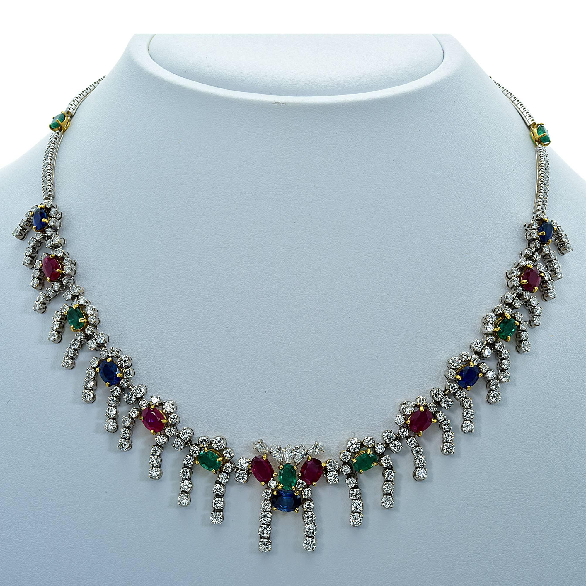 18k white and yellow gold necklace featuring 268 round brilliant and marquise cut diamonds weighing approximately 11cts total, G color VS clarity. Accented by 21 Rubies, Sapphires and Emeralds weighing approximately 13cts total.

Measurements are