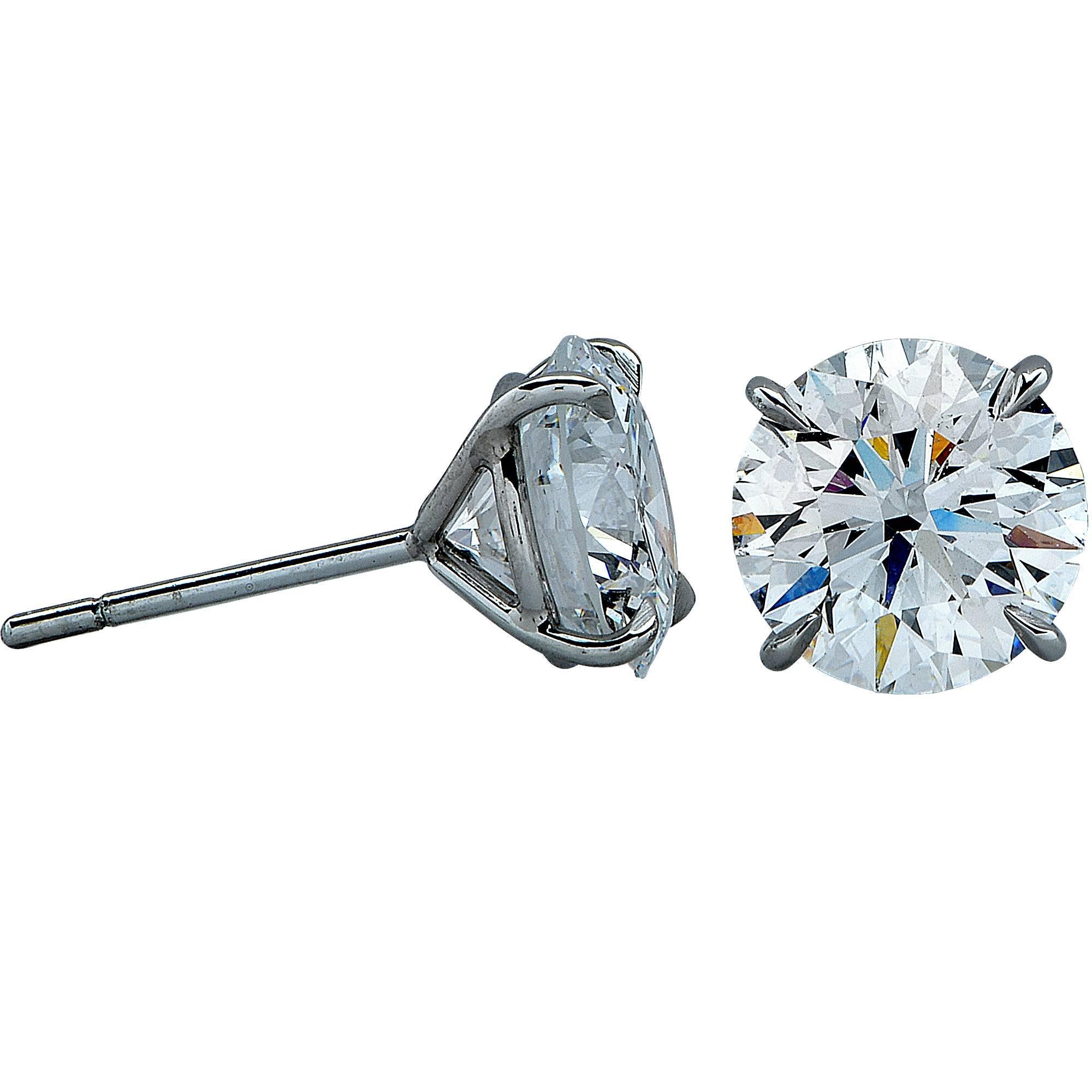 Platinum handmade stud earrings featuring 2 round brilliant cut diamonds weighing 5.13cts total, E color SI2 clarity, one diamond AGS and one GIA certified. Both diamond are excellent cut, symmetry and polish.

Measurements are available upon