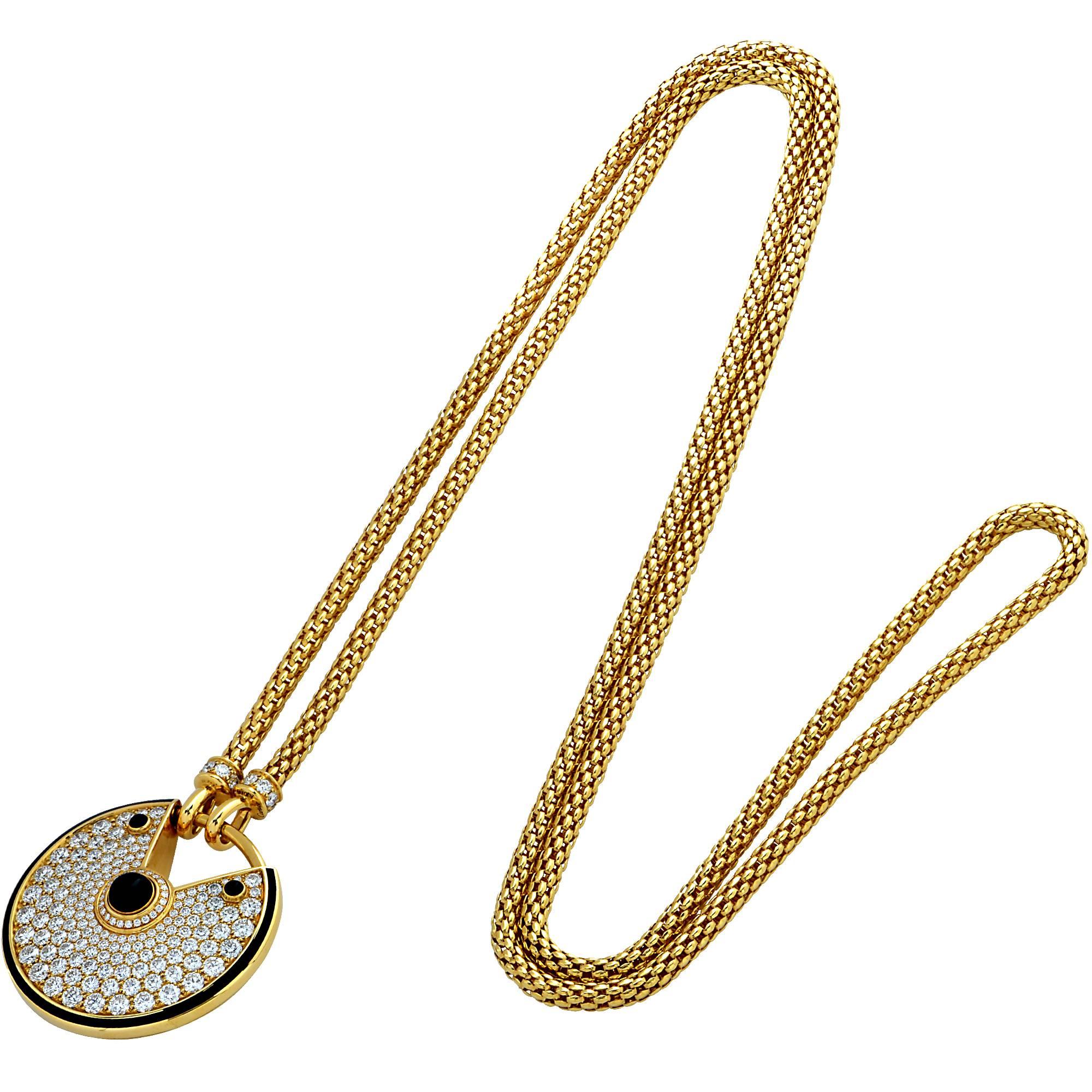 Stunning Amulette De Cartier necklace, crafted in 18k yellow gold and masterly hand set diamond micro pave accented by black onyx and black lacquer. This gorgeous necklace features 178 gleaming round brilliant cut diamonds with a totaling weight of
