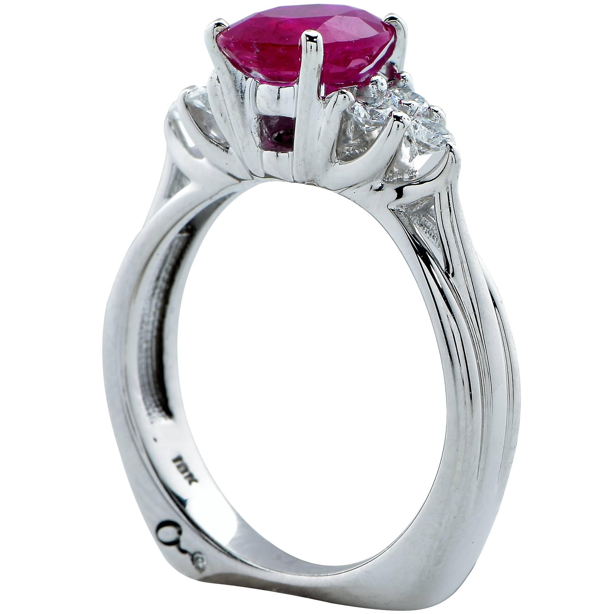 This handmade 18k white gold engagement ring features a beautiful GIA graded 1.57ct heated ruby and is accented by 6 round brilliant cut diamonds which are G color VS clarity. The diamonds weigh approximately .40cts total.

The ring is a size 5.5