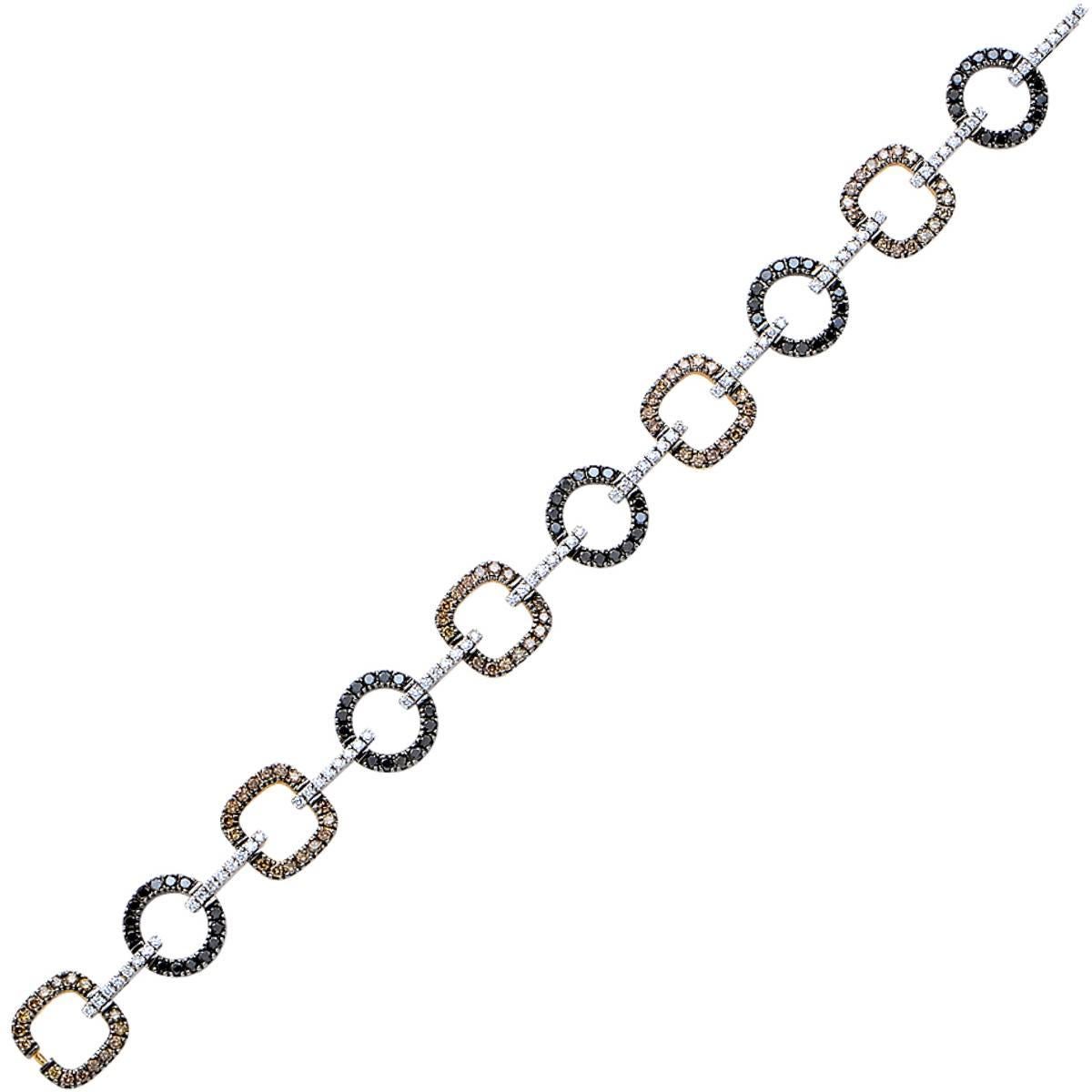 18k white and yellow gold bracelet set with 4.80cts of natural round brilliant cut brown, black and yellow diamonds.

Measurements are available upon request.
It is stamped and/or tested as 18k gold.

This diamond bracelet is accompanied by a retail