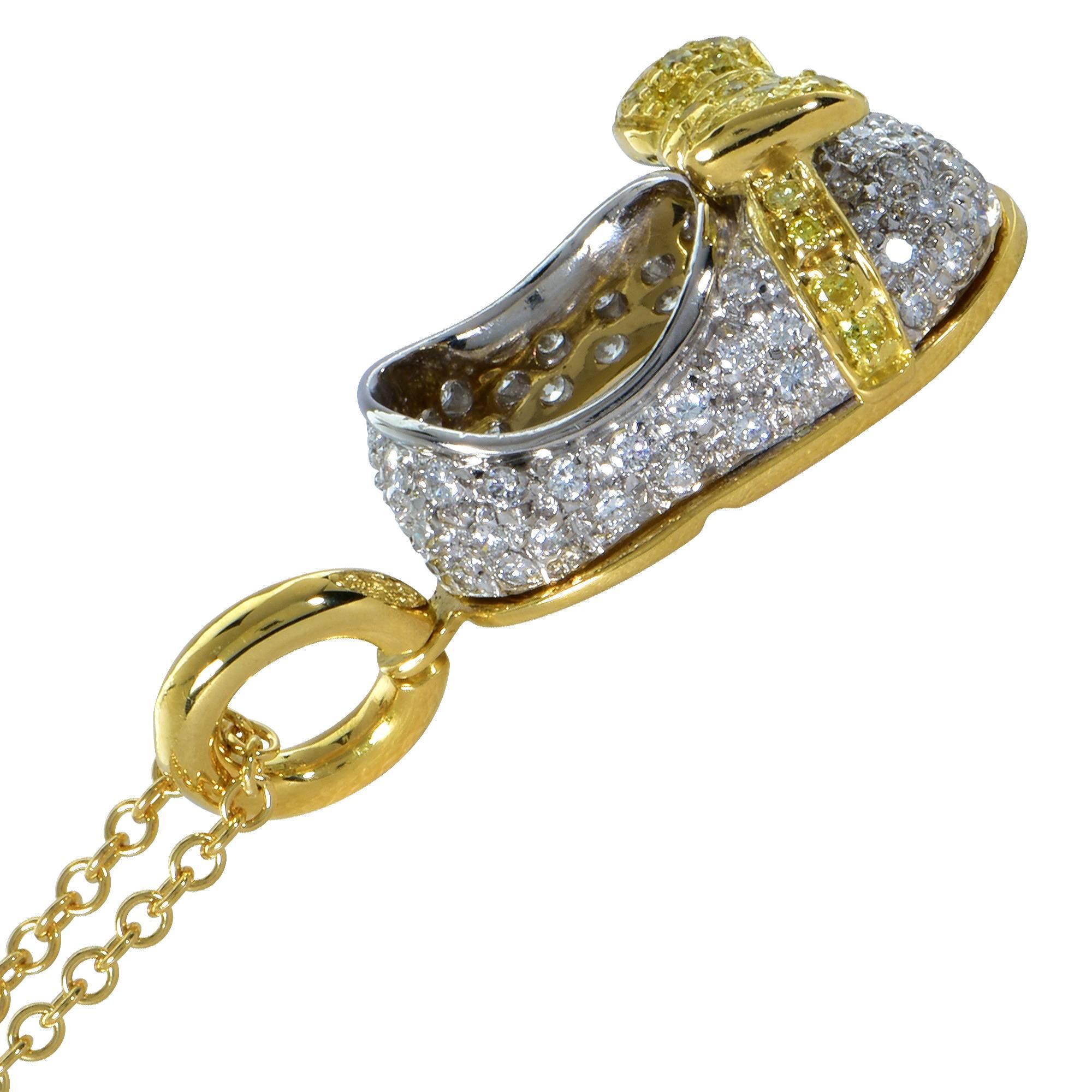 18k white and yellow gold Aaron Basha baby shoe pendant featuring 95 round brilliant cut diamonds weighing approximately 1ct total G color VS clarity and fancy yellow VS diamonds.

Measurements are available upon request.
It is stamped and/or tested
