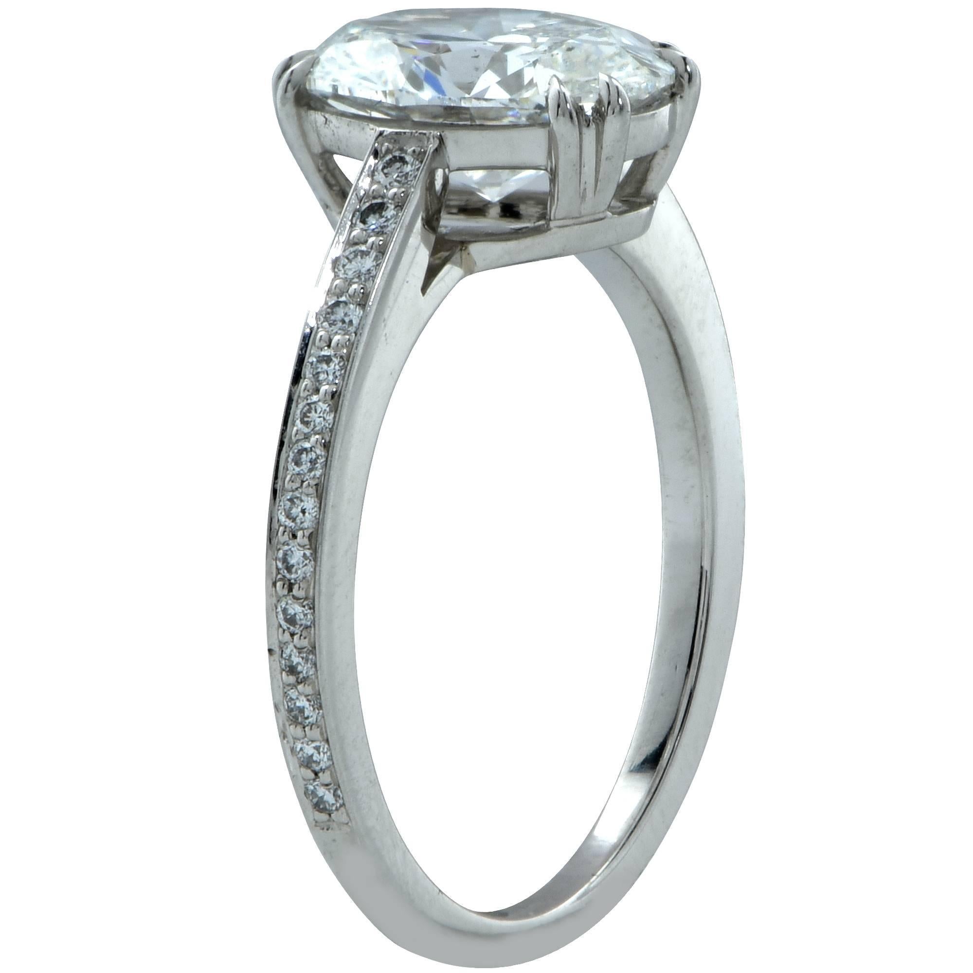 Platinum custom made ring featuring a GIA graded 2.00ct F color SI1 clarity oval cut diamond and accented by 28 round brilliant cut diamonds weighing .19cts total, F color VS clarity.

The ring is a size 6 and can be sized up or down.
Measurements