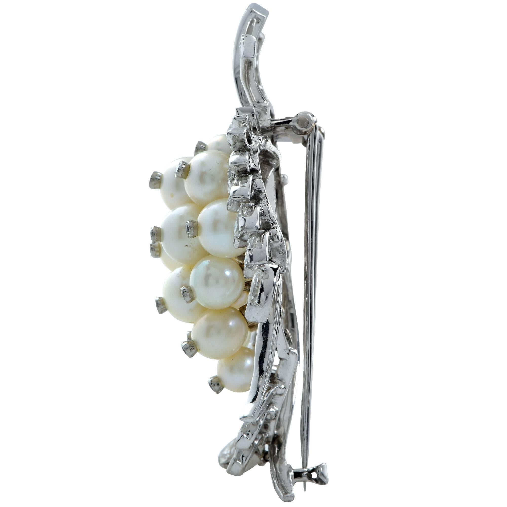 Beautifully crafted platinum brooch featuring 79 marquise, baguette and round brilliant cut diamonds weighing approximately 6cts total, G-J color VS-SI clarity accented by 15 pearls ranging from 5-8mm in diameter.

Measurements are available upon