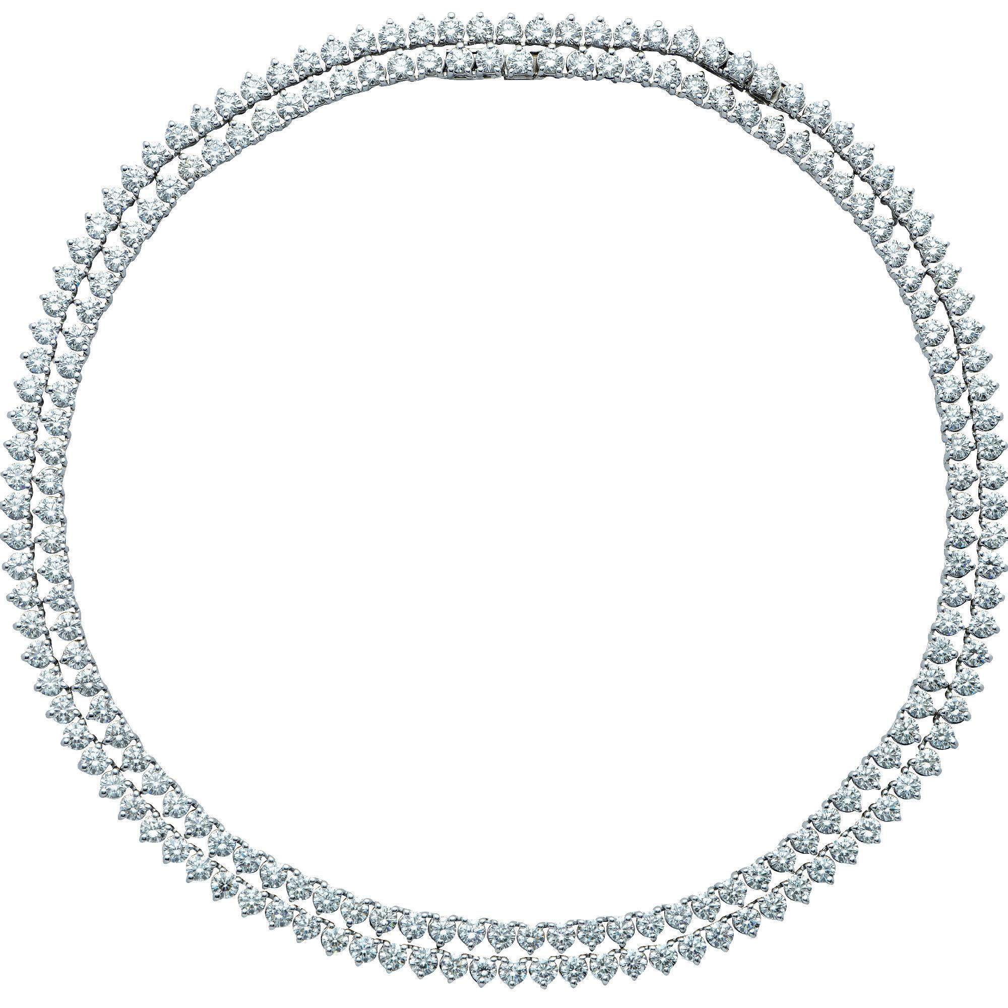 This lovely platinum diamond necklace features two connectable diamond necklaces one measuring 16.50 inches in length and the other measuring 15.50 inches in length. They both measure .19 inch in width. The longest necklace features 102 round