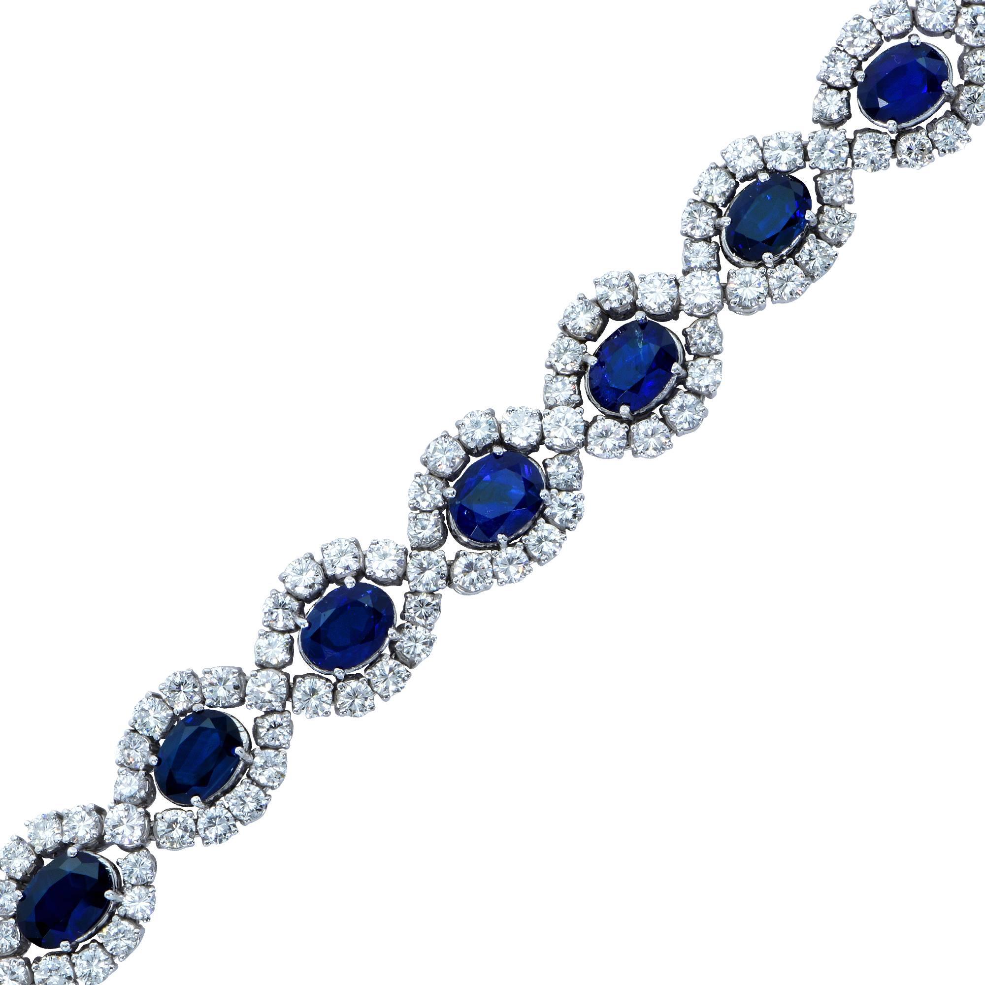 Beautiful sapphire and diamond bracelet featuring 12 oval cut blue sapphires weighing approximately 18cts total accented by 134 round brilliant cut diamonds weighing approximately 11cts total, G color VS clarity, mounted in 18k white