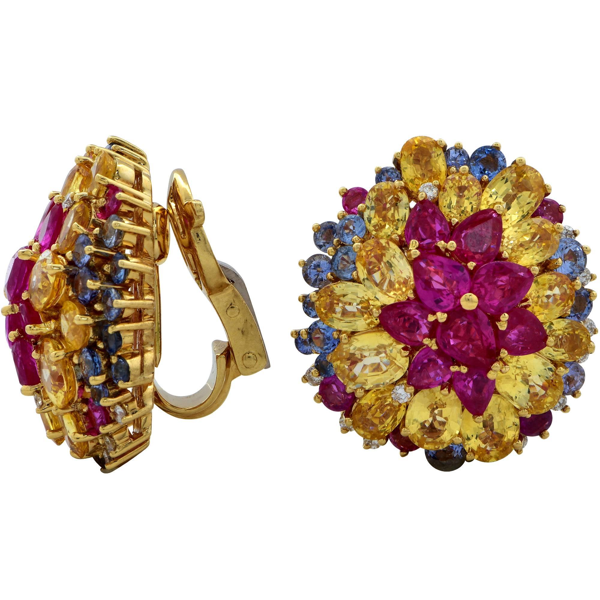 Spectacular 18k yellow gold earrings featuring 84 mixed shape yellow sapphire, ruby, diamond and blue sapphires weighing approximately 17.65cts total accented with 24 diamonds weighing approximately .25cts total.

The earrings measure 22mm by