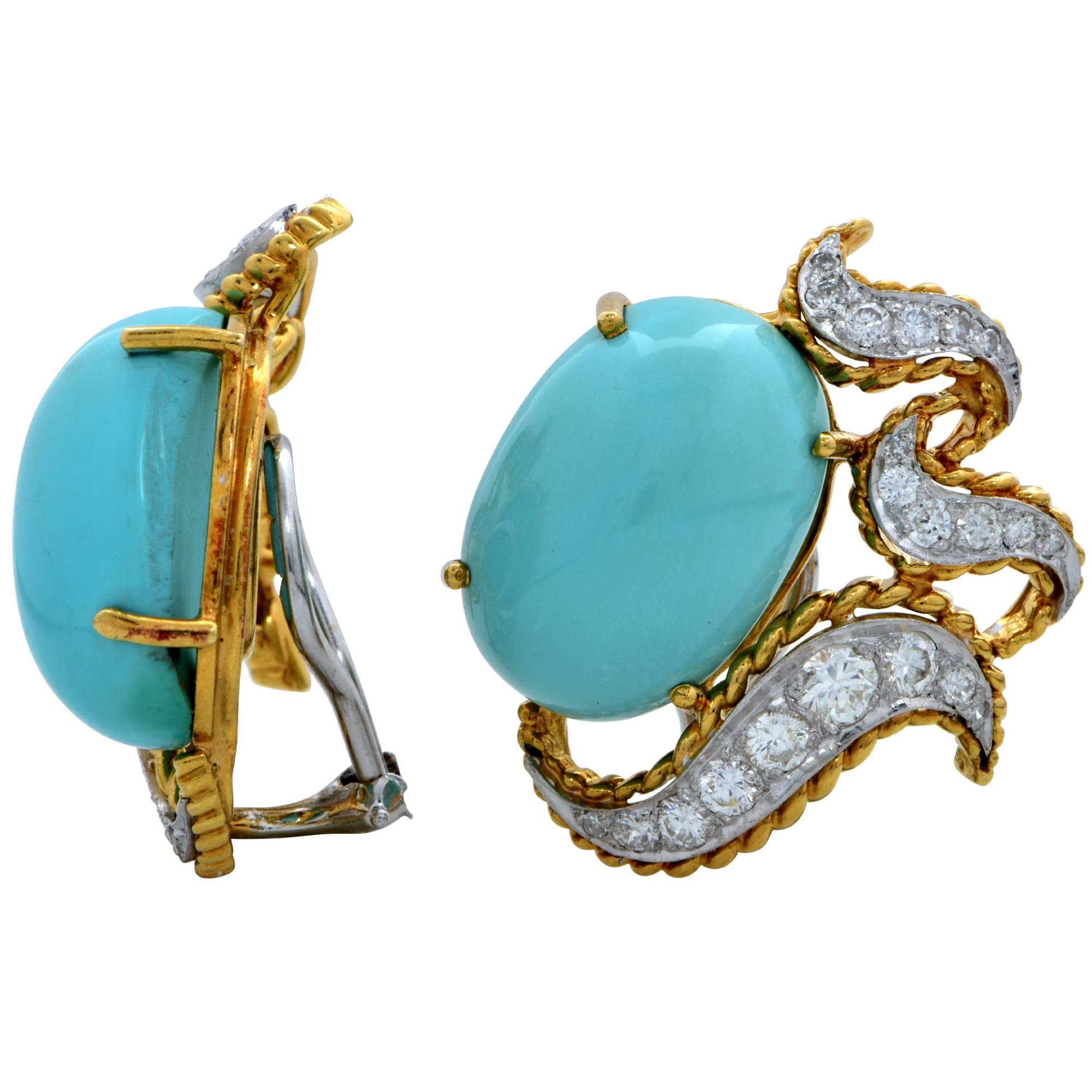 18k yellow gold earrings featuring turquoise cabochons accented by 42 round brilliant cut diamonds weighing approximately 1.6cts total, G color, VS clarity. These earrings measure 29mm x 24.7mm and are currently clip-ons.

It is stamped and/or