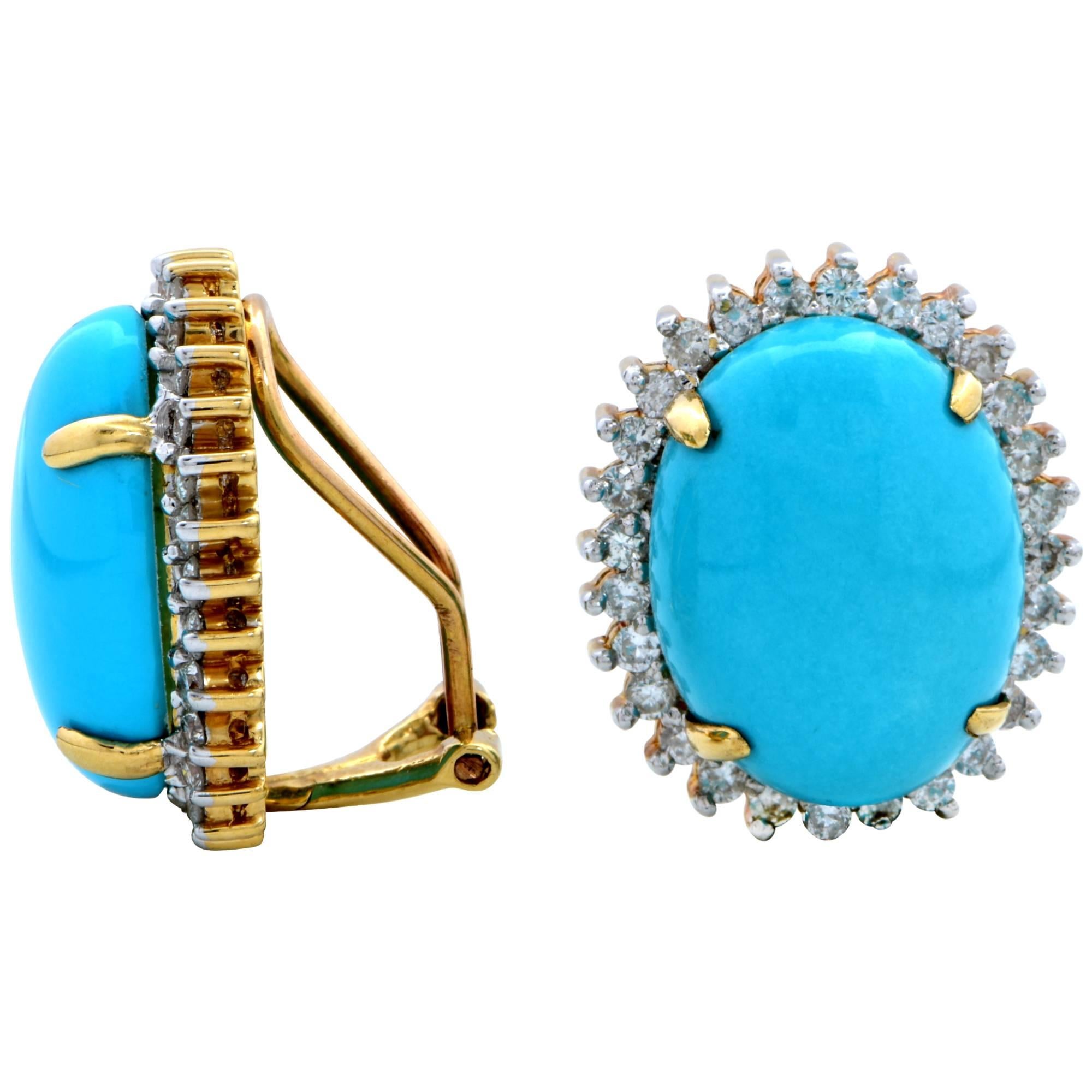 14k yellow gold earrings featuring turquoise cabochons surrounded by 56 round brilliant cut diamonds weighing approximately 1.10cts total, G color, SI clarity. These earrings measure 19.9mm x 16.3mm and are currently clip-ons.

It is stamped and/or