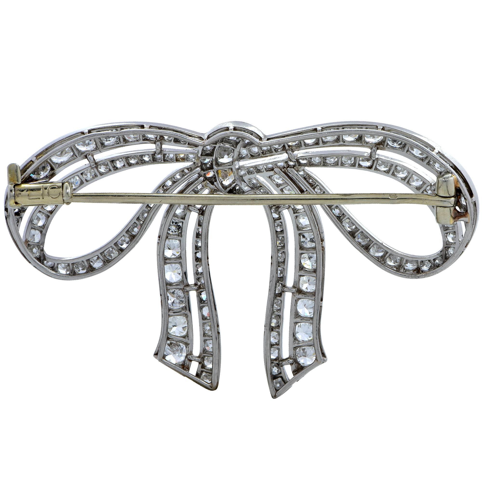 Spectacular French brooch circa 1920s handcrafted out of platinum featuring approximately 3.70cts of European, single and rose cut diamonds, F- G color, VS- SI clarity. Bearing French hallmarks, this classic Art Deco brooch is magnificently crafted