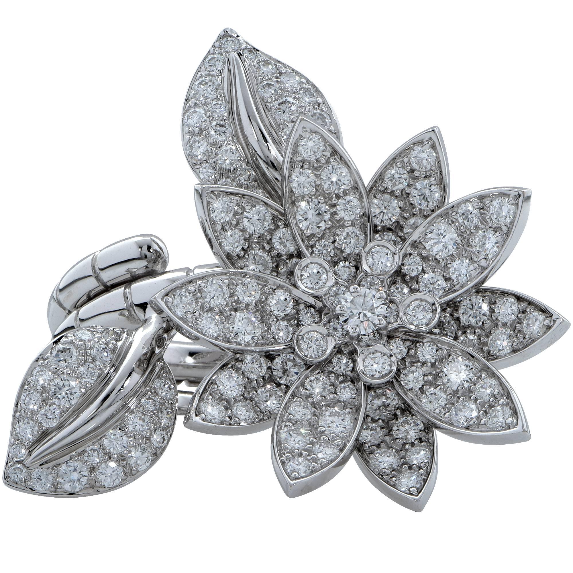 Van Cleef & Arpels Lotus Between the fingers ring hand crafted 18K white gold containing 127 round brilliant cut diamonds weighing 2.13cts D- F color and IF-VVS2 clarity. European size 50, US size 5.25 The current retail is $34,200 USD. A truly