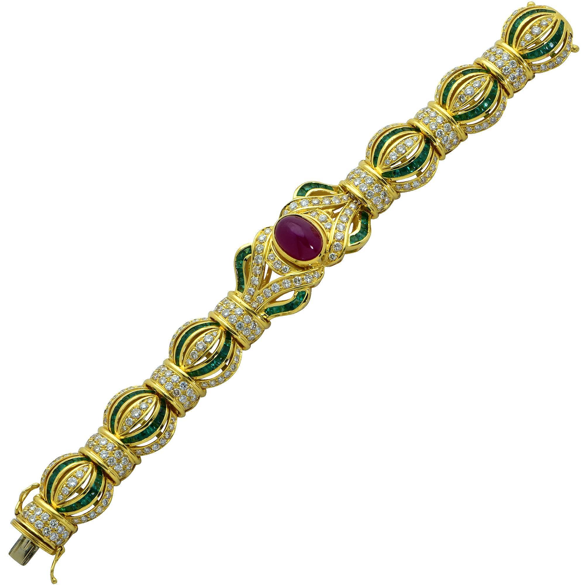 18k yellow gold bracelet signed Giovane featuring approximately 7cts of round brilliant cut diamonds G color VS clarity accented by emeralds and a ruby cabochon.

Measurements are available upon request.
It is stamped and/or tested as 18k gold.
The