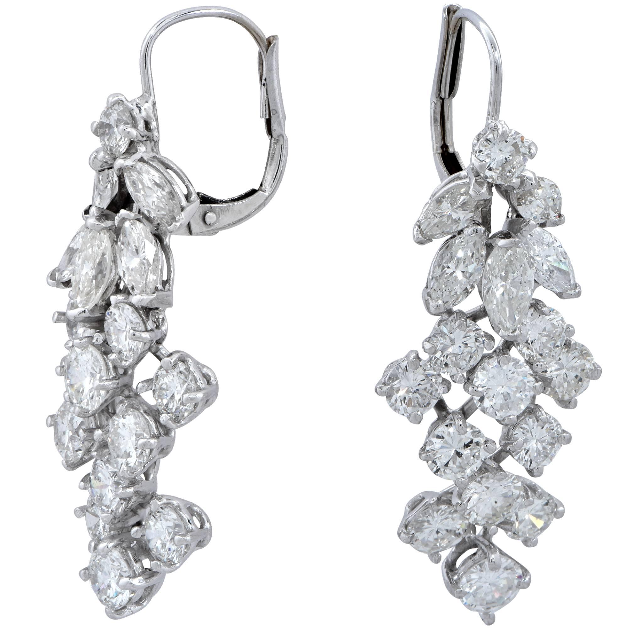 White gold earrings containing 34 round brilliant and marquise cut diamonds weighing approximately 5cts G-I color and VS clarity.

These earrings measure 1.25 inches in length by .50 inch in width.
It is stamped and/or tested as 18k gold.
The metal