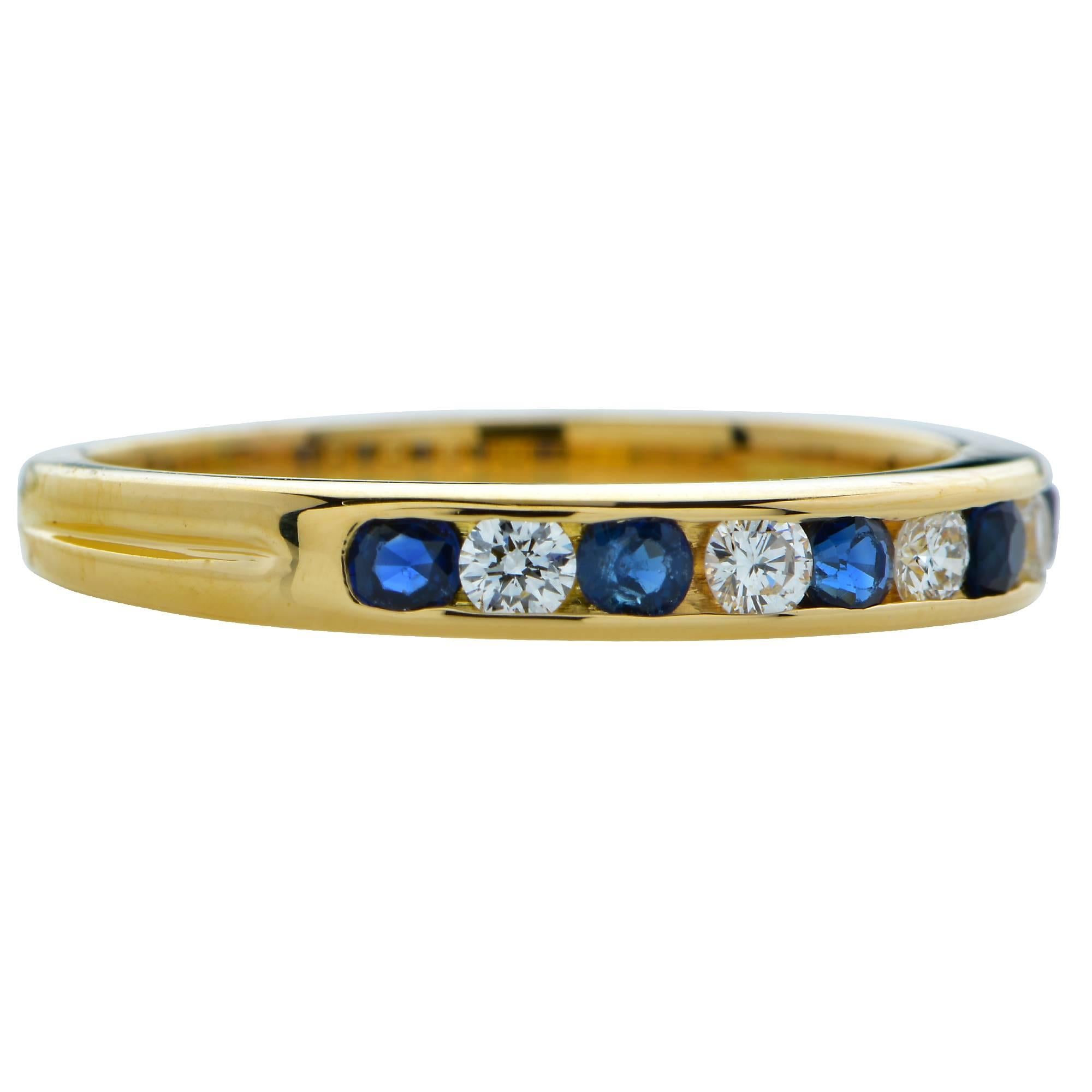 This fabulous Tiffany & Co. band is a bold and perfect complement for an everyday band. Spectacularly crafted in 18 karat yellow gold, this band exemplifies Tiffany scrupulous craftsmanship and gem selection.  This band showcases 4 channel set round