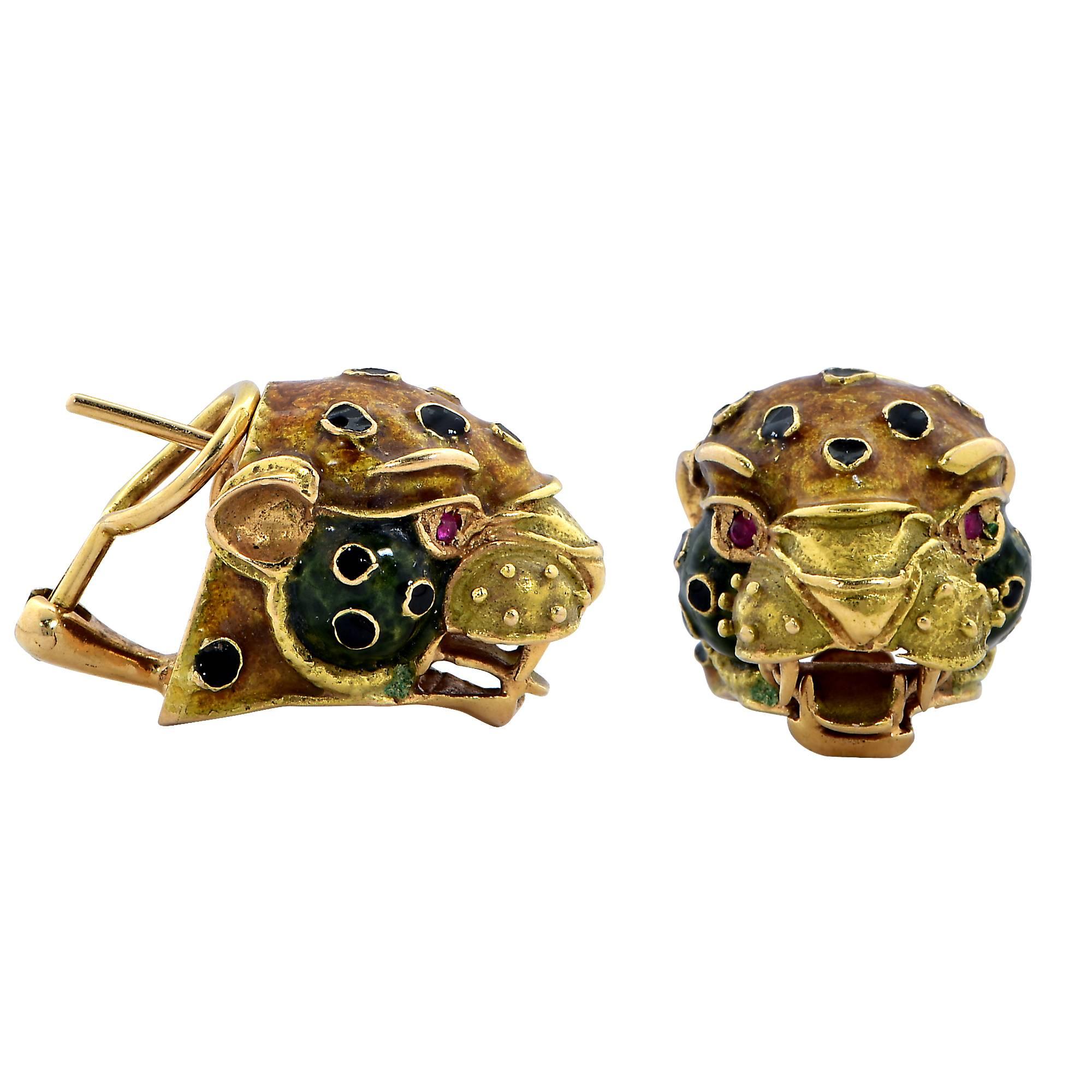 Crafted in 18k yellow gold these earrings feature leopards adorned with vibrant yellow and green enamel. From Spain this fourth generation family of jewelers have bestowed tradition, high technological and ancestral techniques of their culture. The