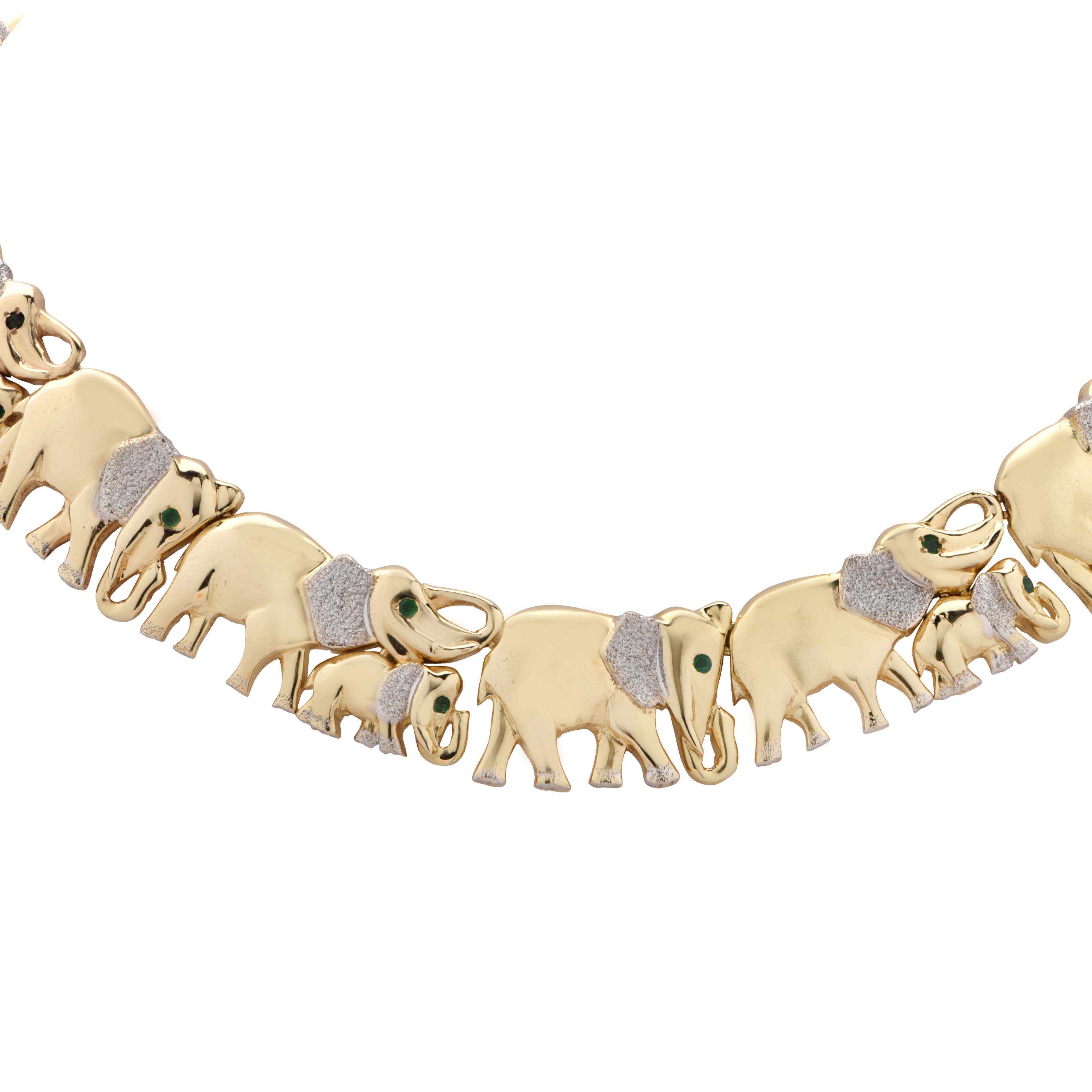 Stunning necklace perfectly depicting a glorious herd of elephants, crafted in yellow gold and detailed with white gold textured ears and feet. The elephants symbolize a deep family bond and loyalty. This delightful necklace measures .7 inches in