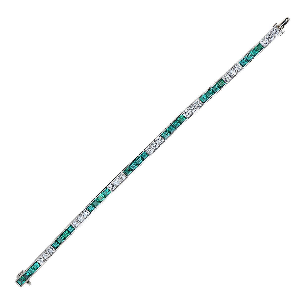 This elegant platinum Tiffany & Co. bracelet features 28 square emeralds weighing 6.06cts and 21 round brilliant cut diamonds weighing 2.89cts, F color, VS clarity.

The bracelet measures 7 inches in length.
It is stamped and tested as