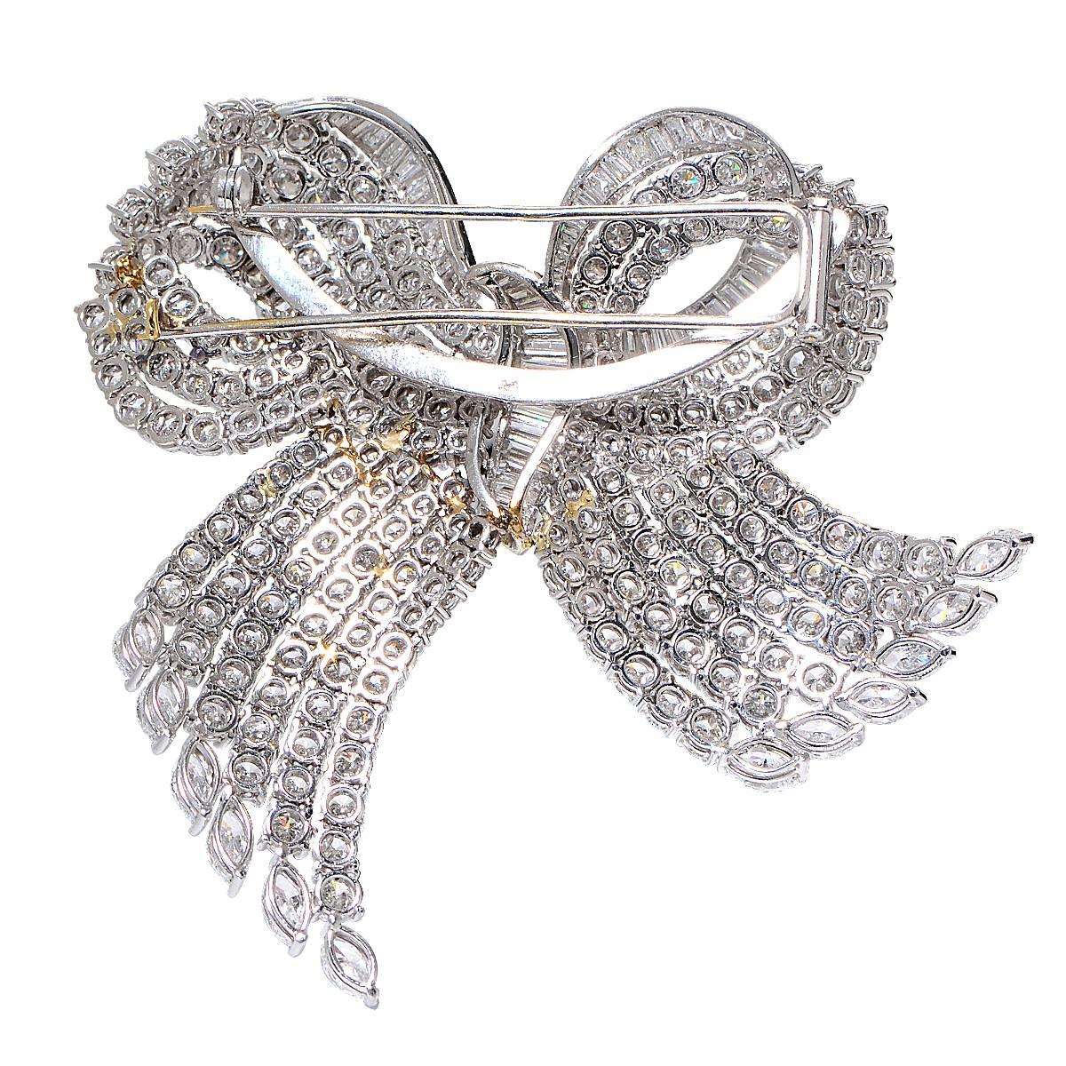 Platinum Bow Pin Containing 291 Round Brilliant, Baguette and Marquise Cut Diamonds Weighing Approximately 24cts, F Color, VS Clarity.