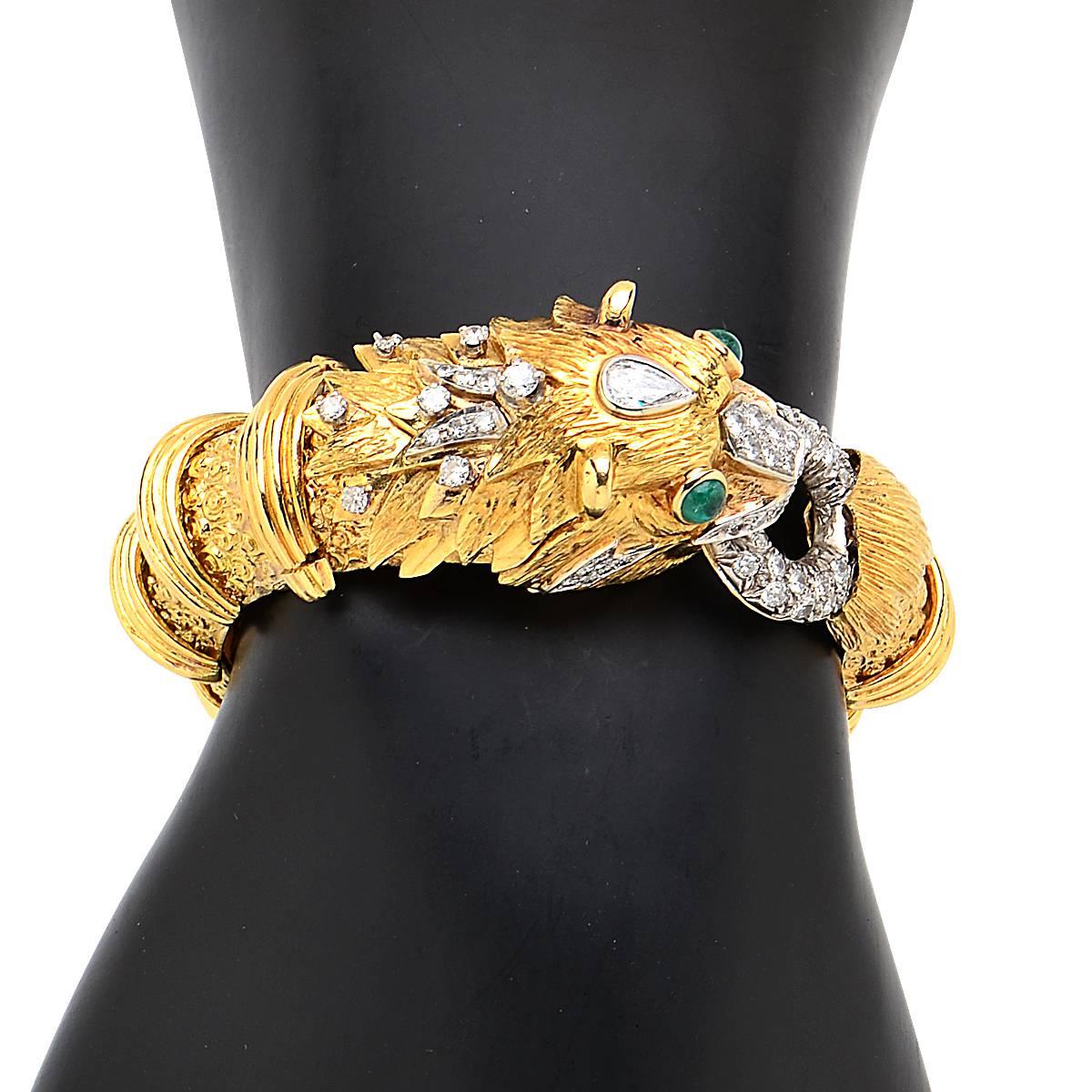 18 Karat Yellow Gold Lion Bangle Featuring 3.12cts of Round Brilliant Cut and Pear Shape Cut Diamonds, G Color, VS-SI Clarity.