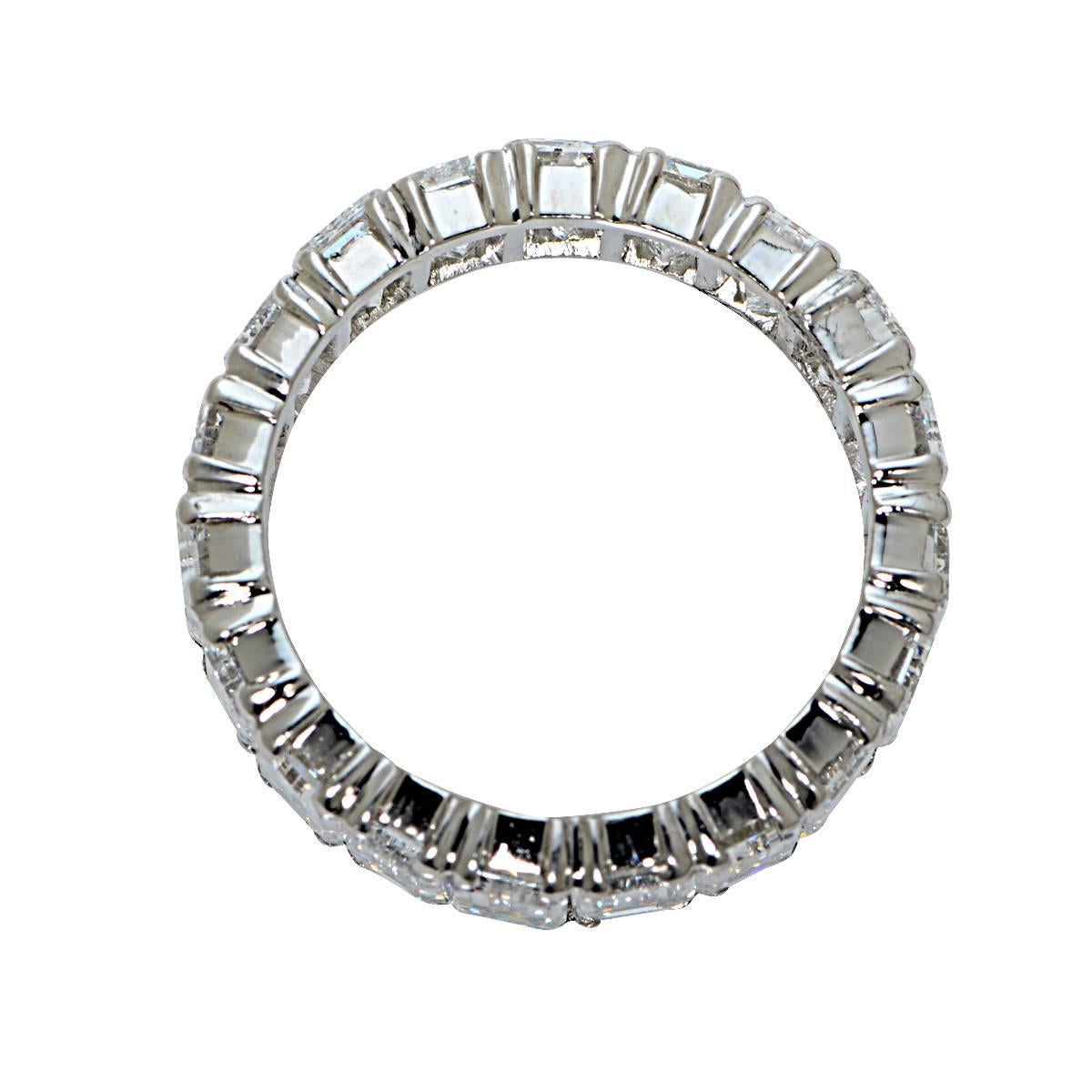 Platinum Eternity Band with 19 Emerald Cut Diamonds Weighing Approximately 9.10cts, F Color, VS Clarity. Ring Size: 7.