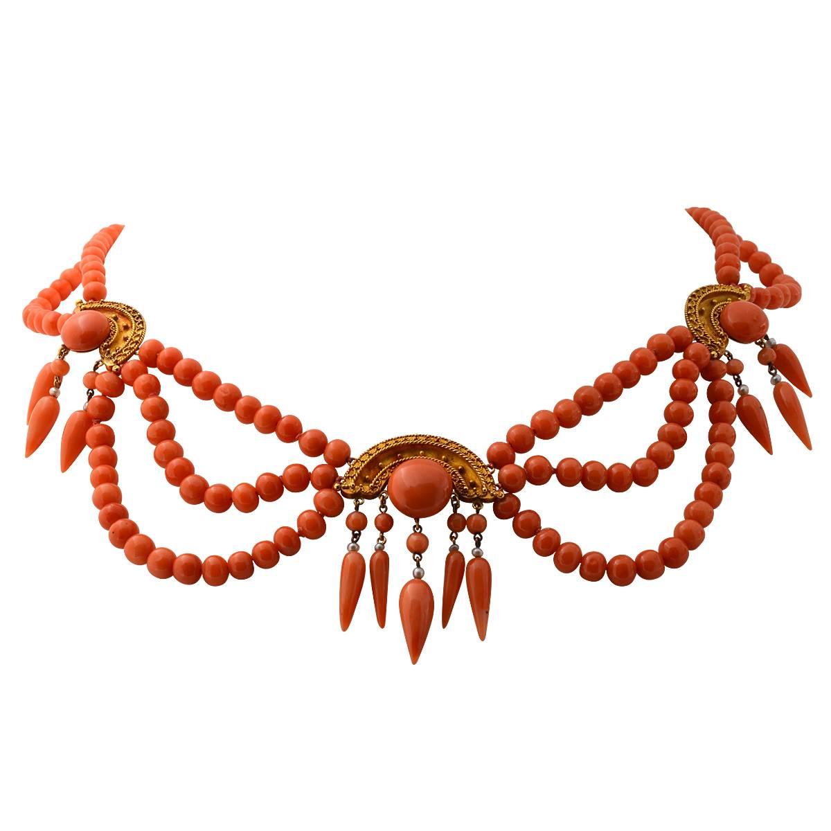This gorgeous 20k yellow gold Etruscan revival coral set includes a necklace, bracelet, earrings and pin/brooch, circa 1880s.

The necklace weighs 50.30 grams. The necklaces inner circumference measures 16 inches. The necklace starts with two