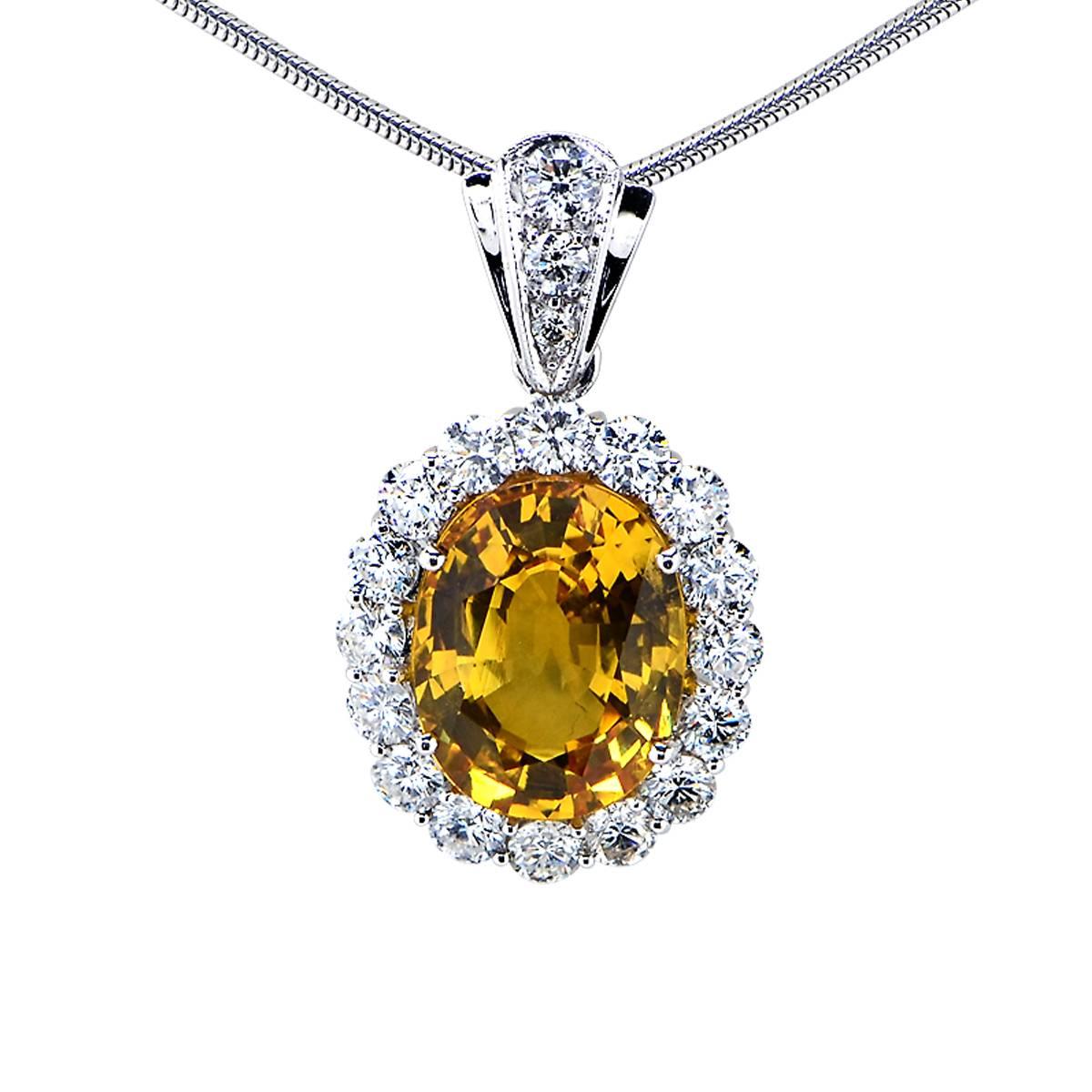 18 Karat White Gold Necklace Featuring a 9ct Oval Cut Vibrant Yellow Sapphire Accented by 17 Round Brilliant Cut Diamonds Weighing 2.50cts Total, G Color, VS Clarity.