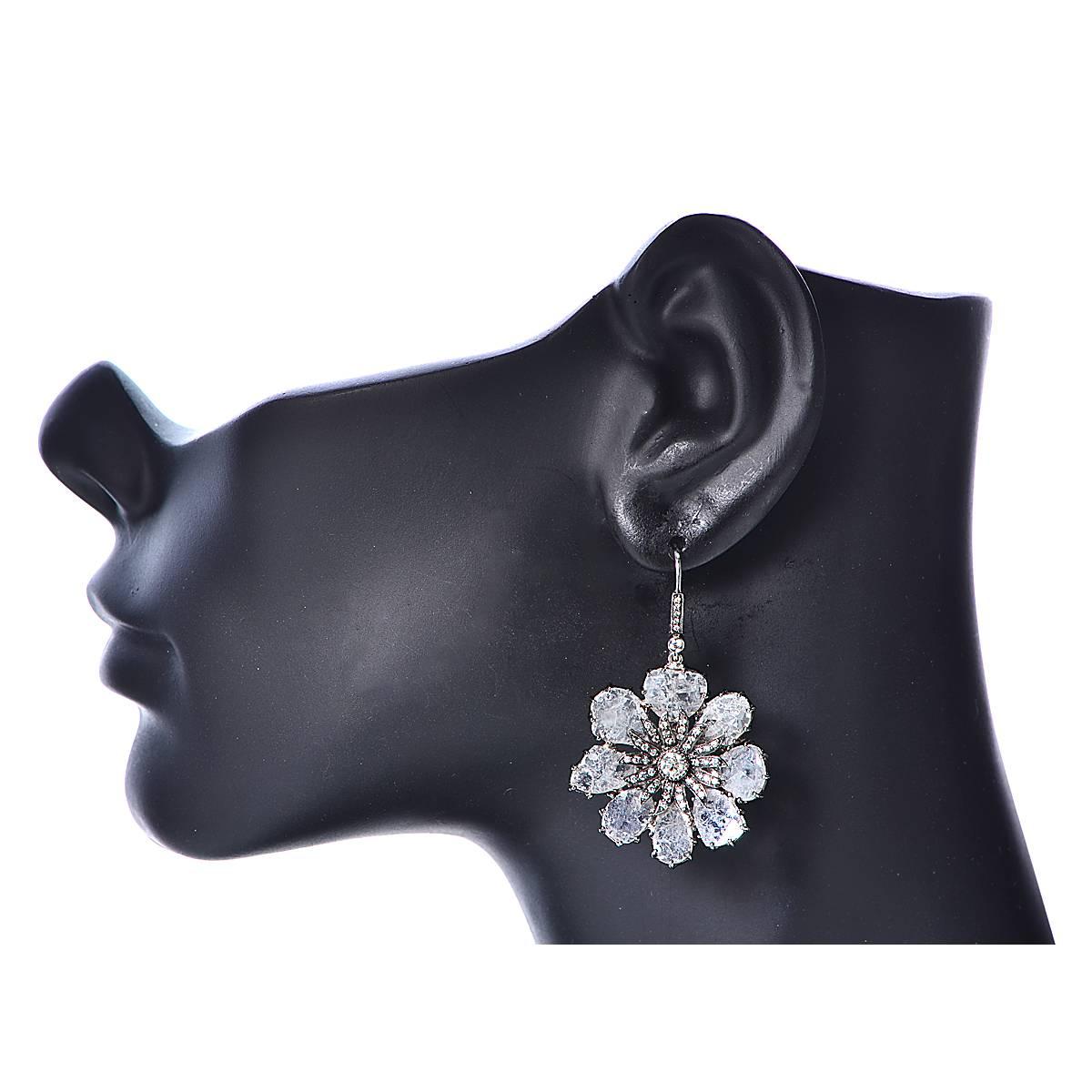 Stunning Vivid Diamonds earrings crafted in 18 Karat White Gold, featuring diamond slices weighing approximately 14.14 carats total. The diamond slices are arranged in gorgeous flowers, capturing the unparalleled beauty of nature.