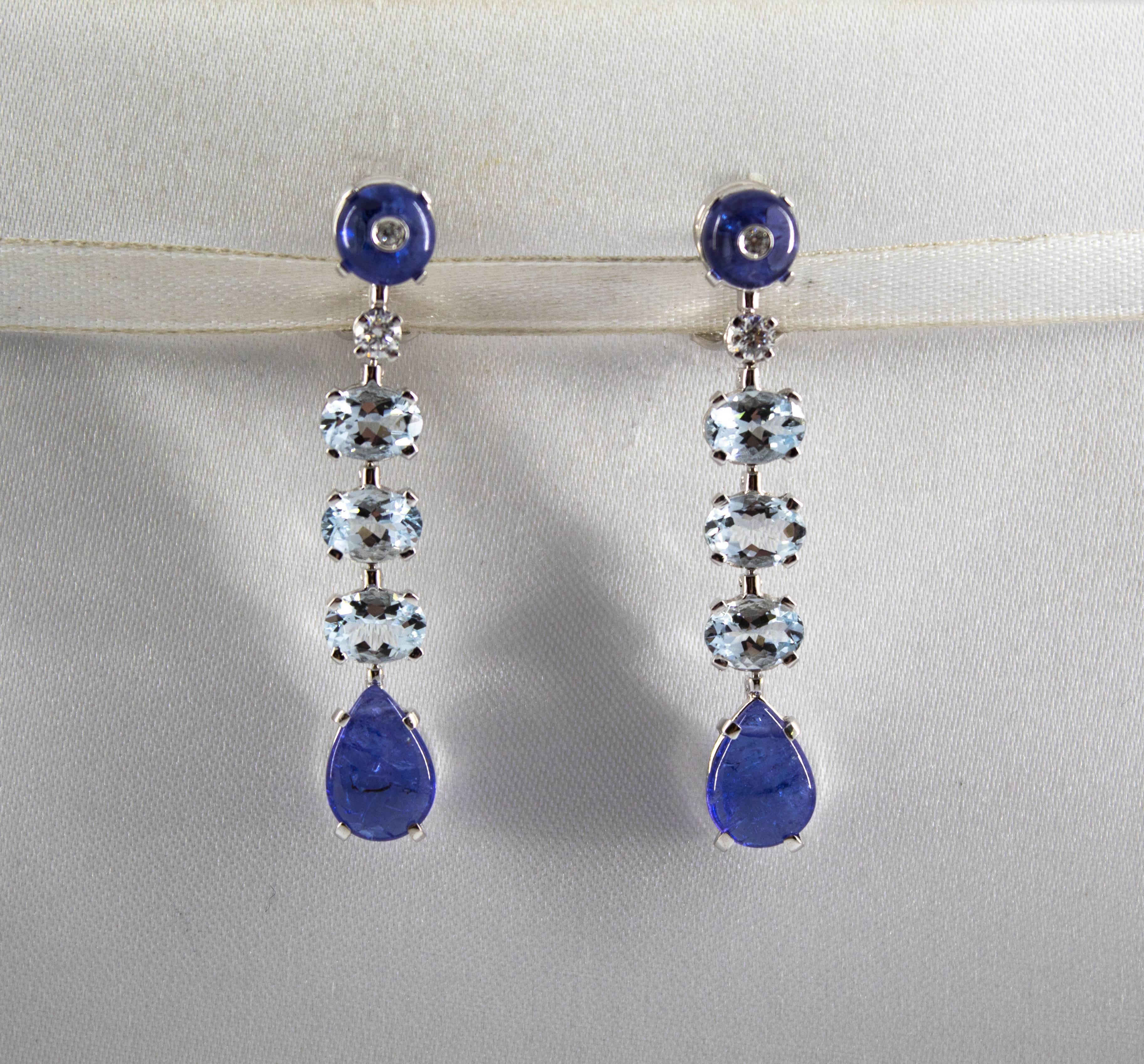 These Earrings are made of 18K White Gold.
These Earrings have 0.24 Carats of White Diamonds.
These Earrings have 3.70 Carats of Aquamarine.
These Earrings have 8.70 Carats of Tanzanite.
All our Earrings have pins for pierced ears but we can change