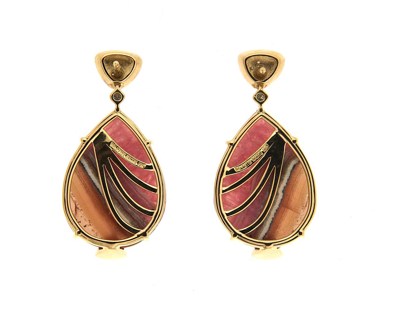 This unique pair of earrings features pear shape Honey Rhodocrosite and round brilliant diamonds. The earrings are made in 18kt Yellow Gold. The bottom stones are removable.