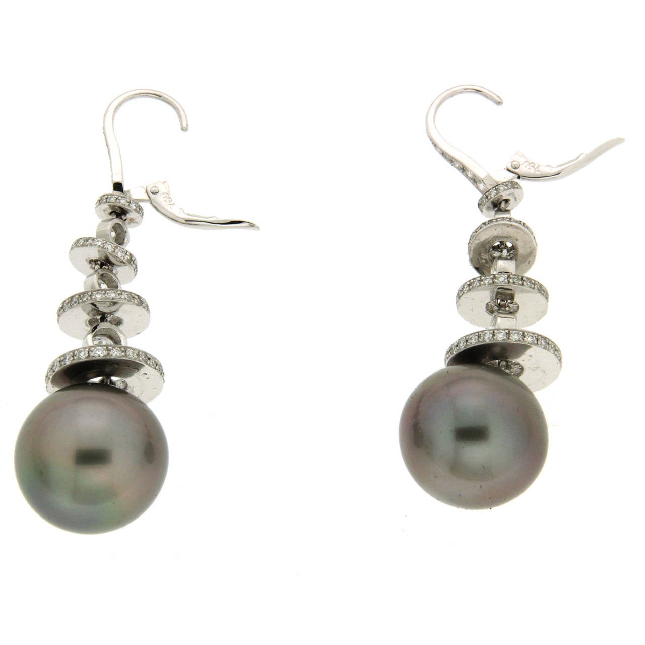 Pave Disks with Round Brilliant Diamonds in between and 16.3mm Tahitian Pearls at the bottom.