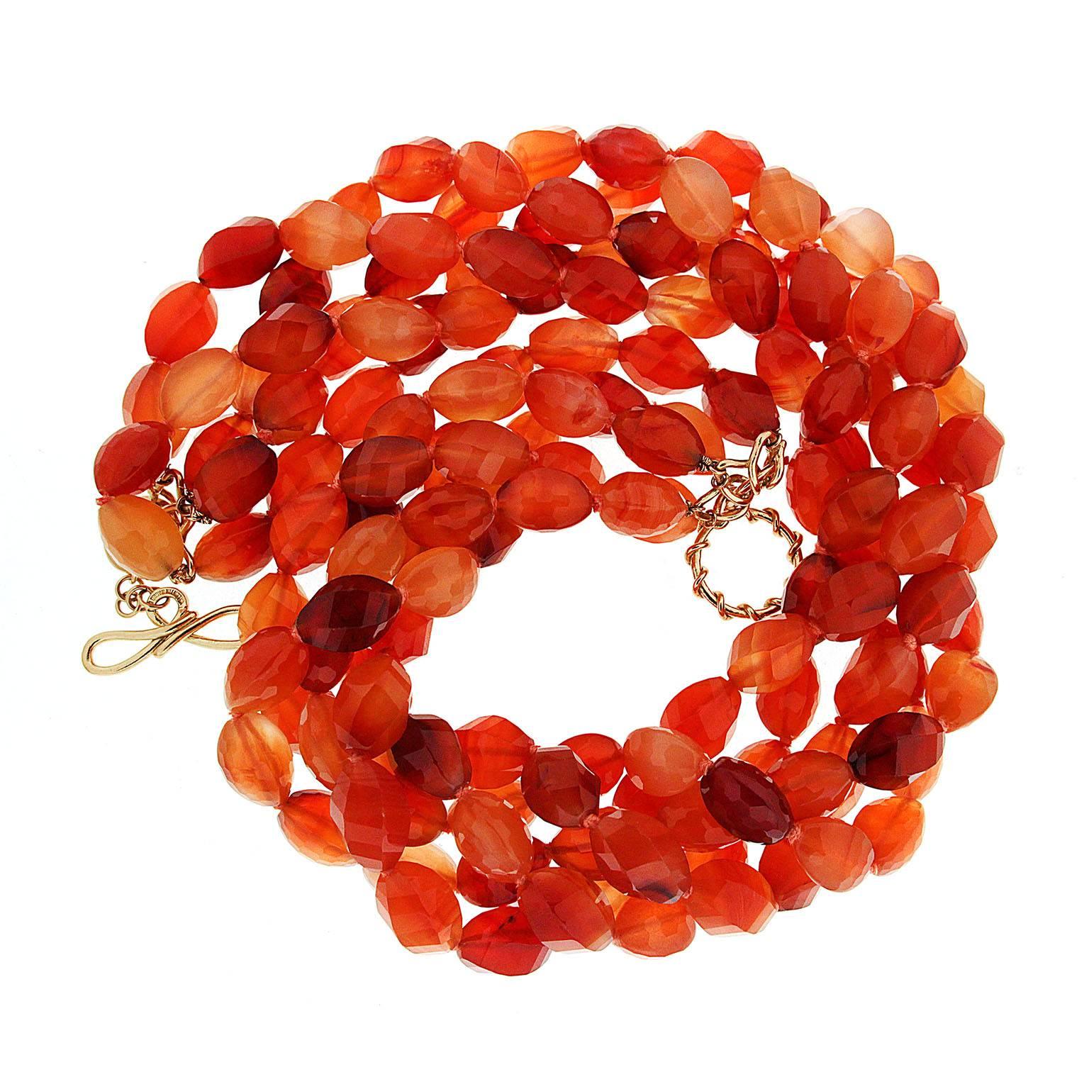 This necklace features five strands of carnelian stones with an 18kt yellow gold ring and toggle clasp.