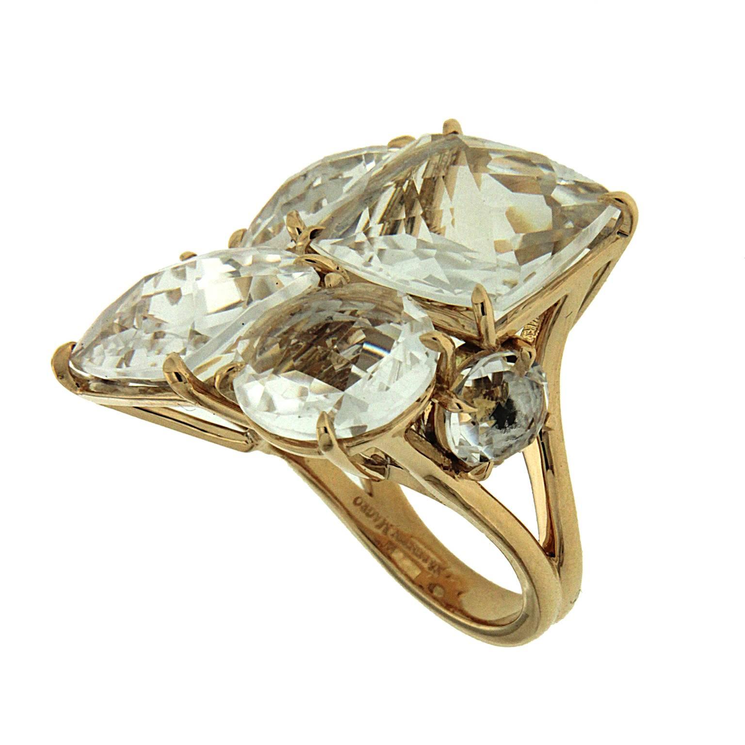 This ring features 6 special cut Cushion and Round Crystal stones with trellis settings in 18kt Yellow Gold. Total stone weight is about 29.45ct