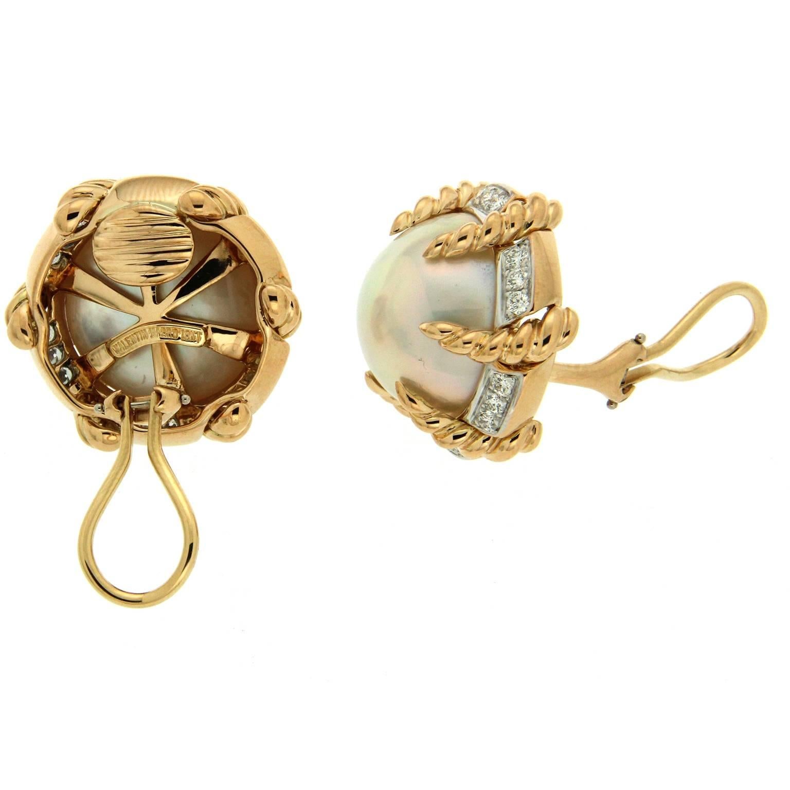 These earrings are made in 18kt yellow gold, they feature mabe pearls and round brilliant diamonds with a carat total weight of 1.08. Backs are clip-backs.
