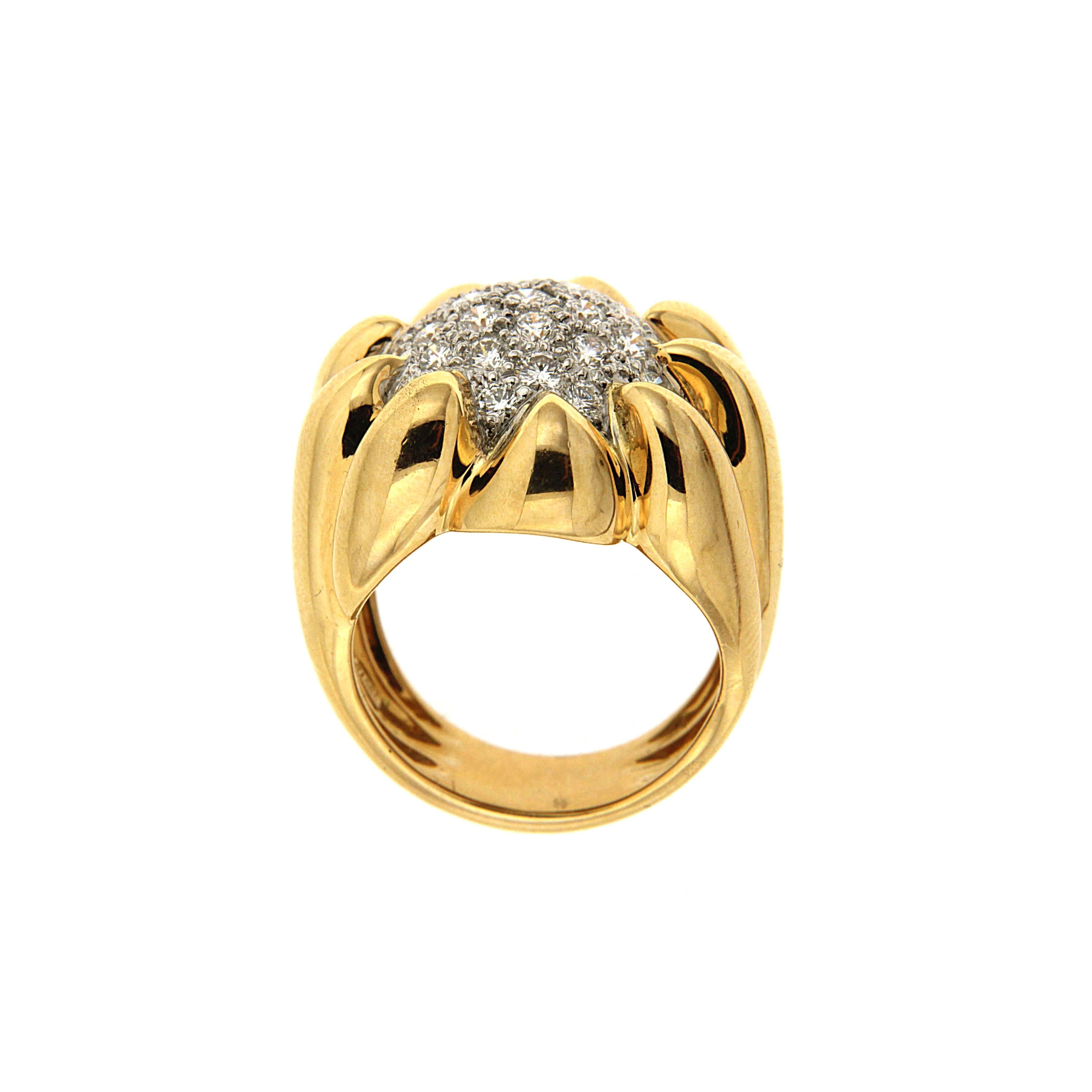 This ring is made in 18kt yellow gold and platinum. It features 1.59 ctw of round brilliant pave set diamonds.