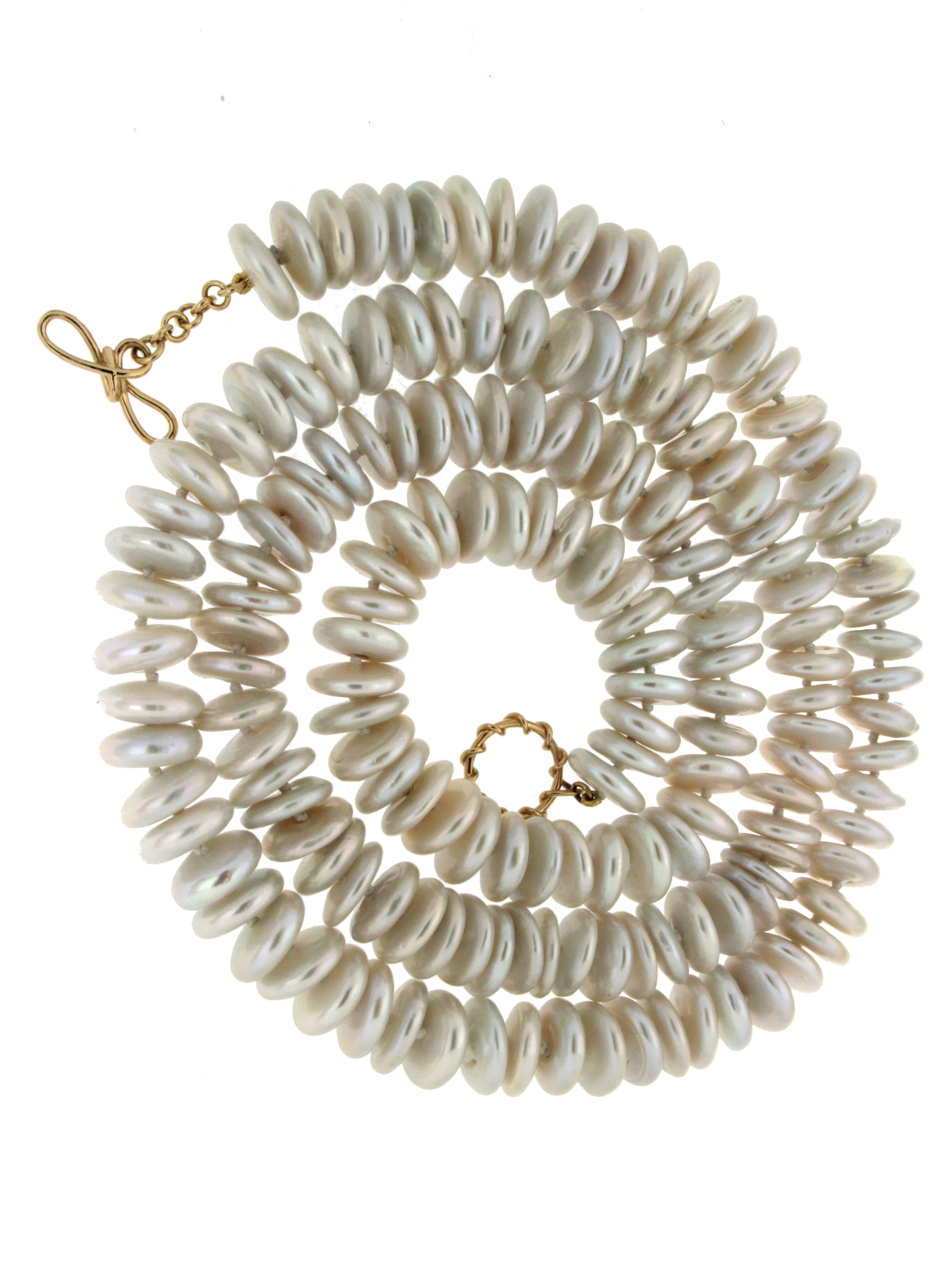 This necklace features a strand of fresh water baroque disk pearls, it is complete with an 18kt yellow ring and toggle clasp.

Valentin Magro is the artisan creating this interesting necklace. Having spent twenty-five years collaborating with the