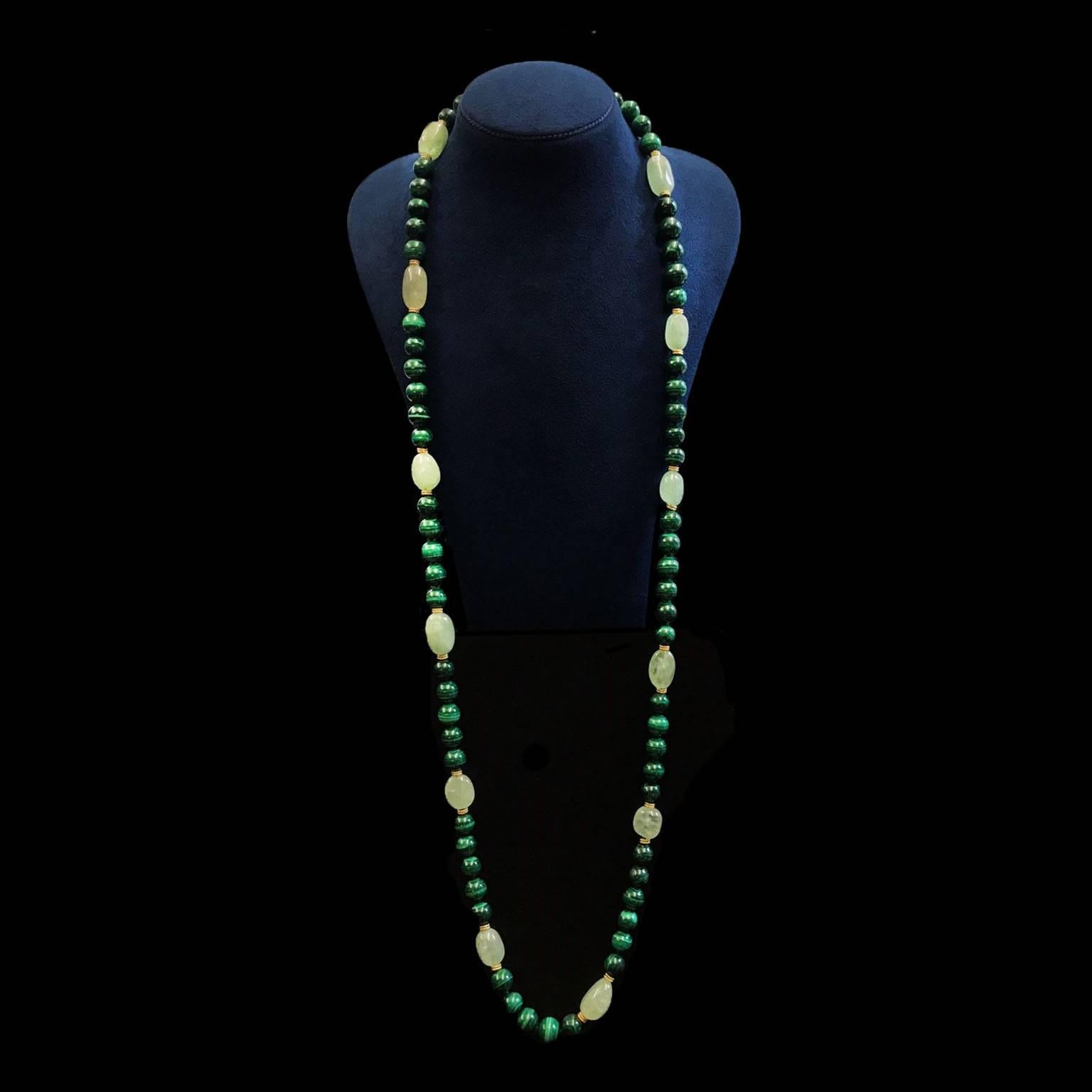 Emerald chunks and malachite necklace with 18kt yellow gold double wire roundels in between and is finished with gold ball clasp.