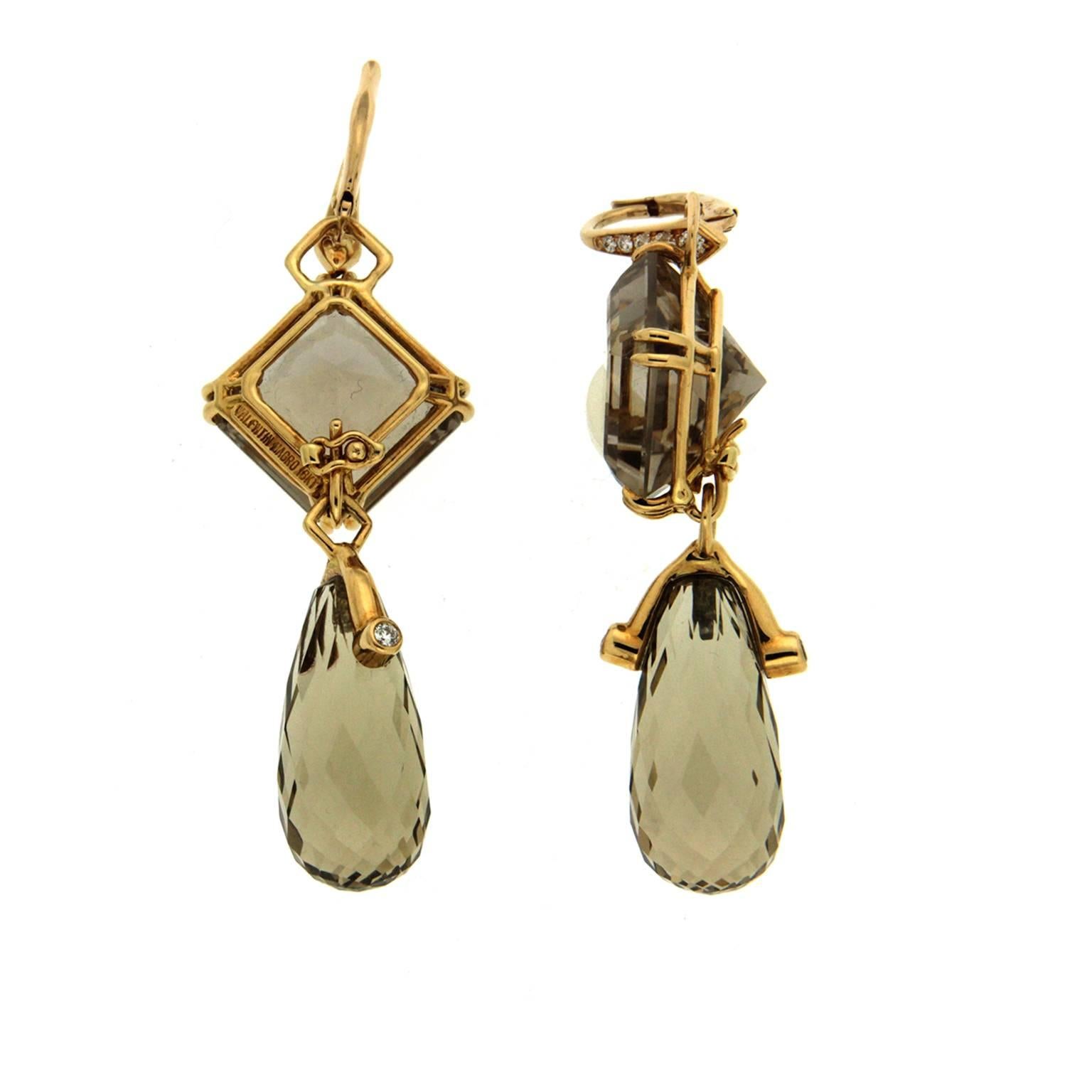 This pair of earrings features square cut Brown smokey (14x14mm) tops with briolette cut lemon Citrine drops (22x10mm) and is completed with diamond lever back and in 18kt yellow gold.