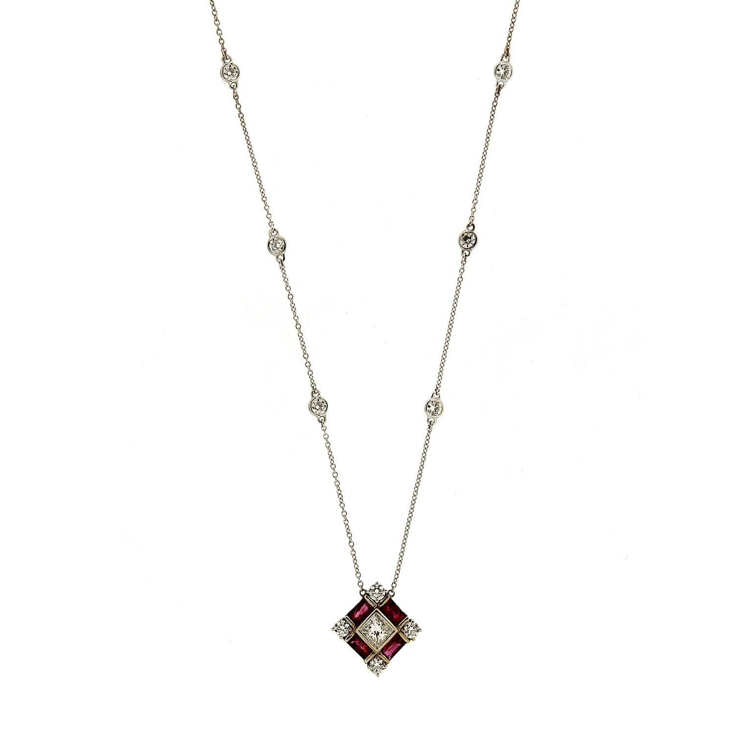 Princess Cut Center Diamond with Baguette Rubies and Round Diamonds Side stones with 6 bezel set Diamonds on 16
