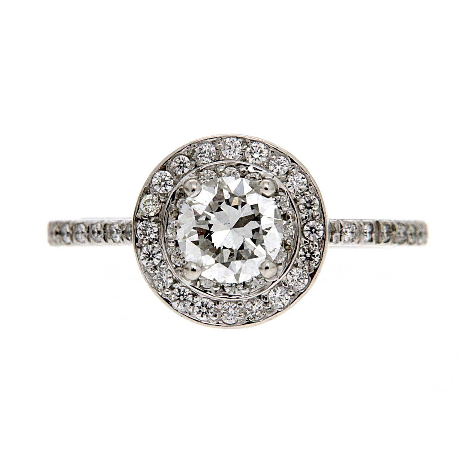 This ring features a 0.52ct Round center diamond GIA Certified (E VS2) and Double Halo with micro pave on the shank. The ring is finished in 18kt white gold. 

Diamond Total Weight: 0.87ctw

GIA certification number: 5172527944
