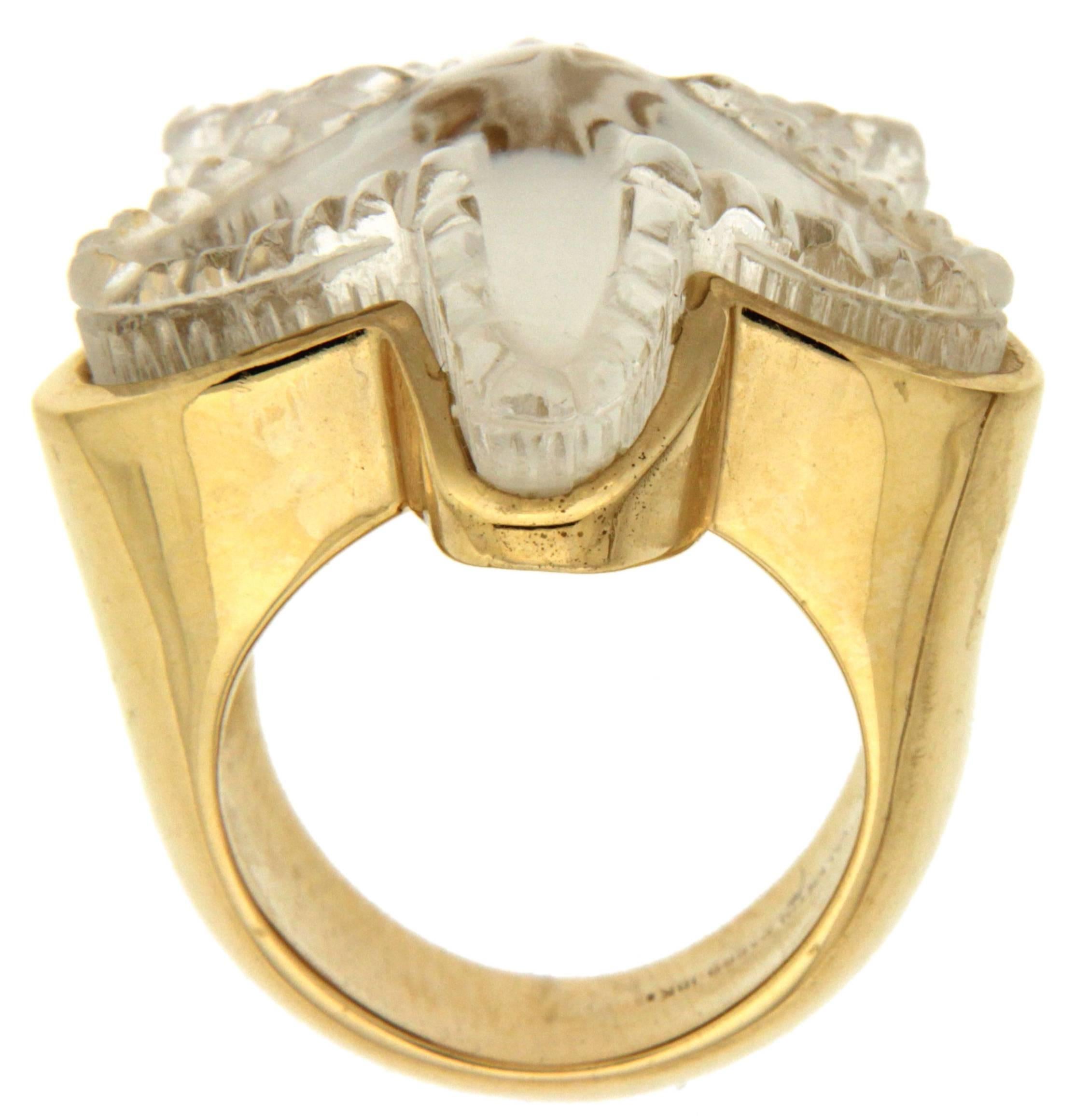 This starfish ring is made in 18kt yellow gold, it features a special cut crystal and mother of pearl beneath the crystal.