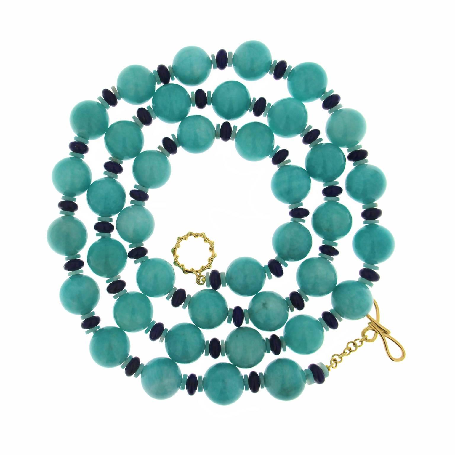 This unique necklace is designed with 16mm amazonite Balls and double 8mm lapis lazuli rondelles in between. The necklace is finished with 18kt yellow gold ring and toggle clasp. The result is an exquisite jewel and the perfect gift for any
